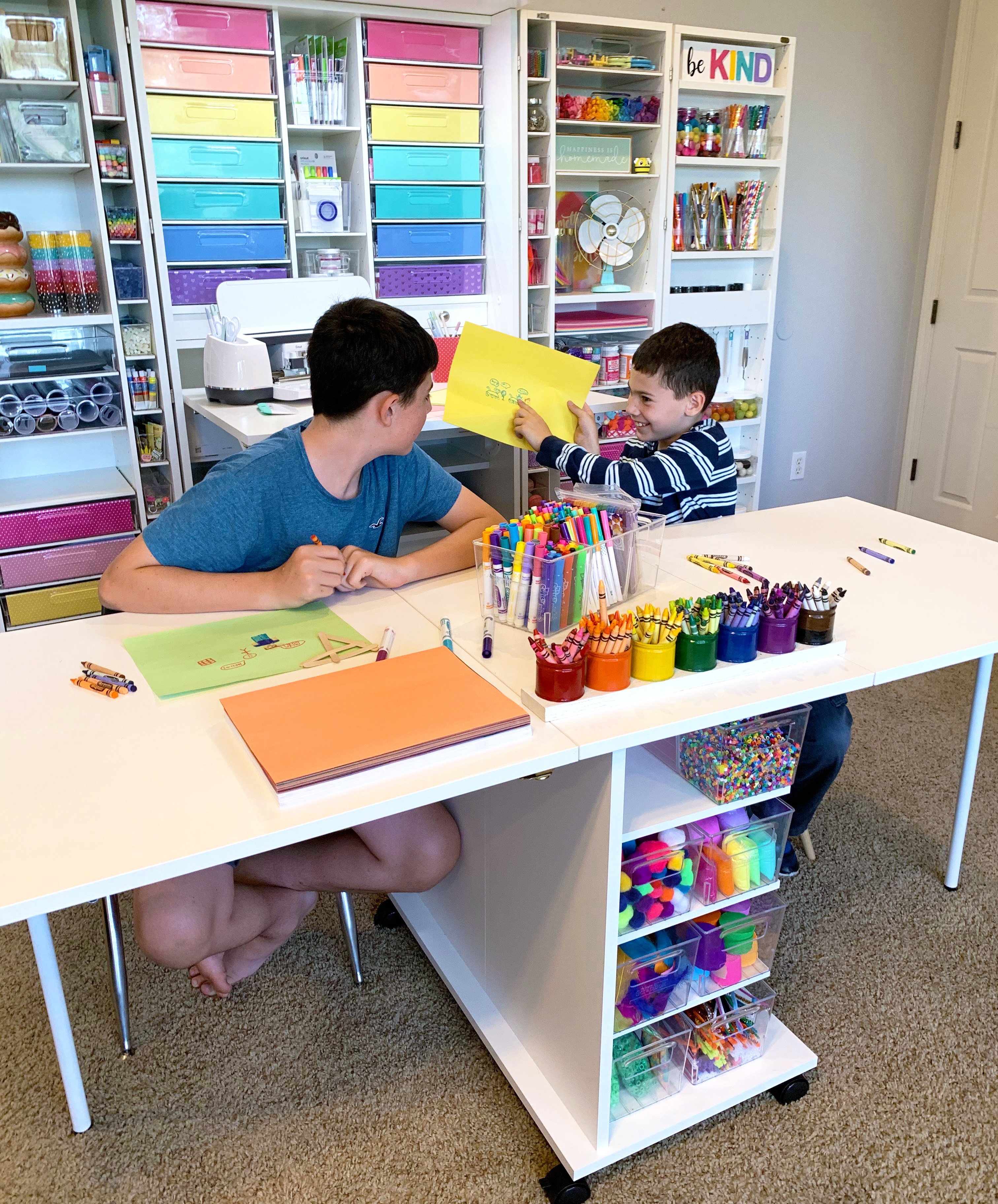 kids playing at dreamcart and using craft materials