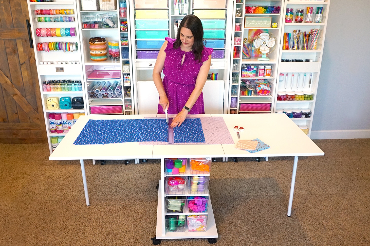 woman using dream cart while cutting materials