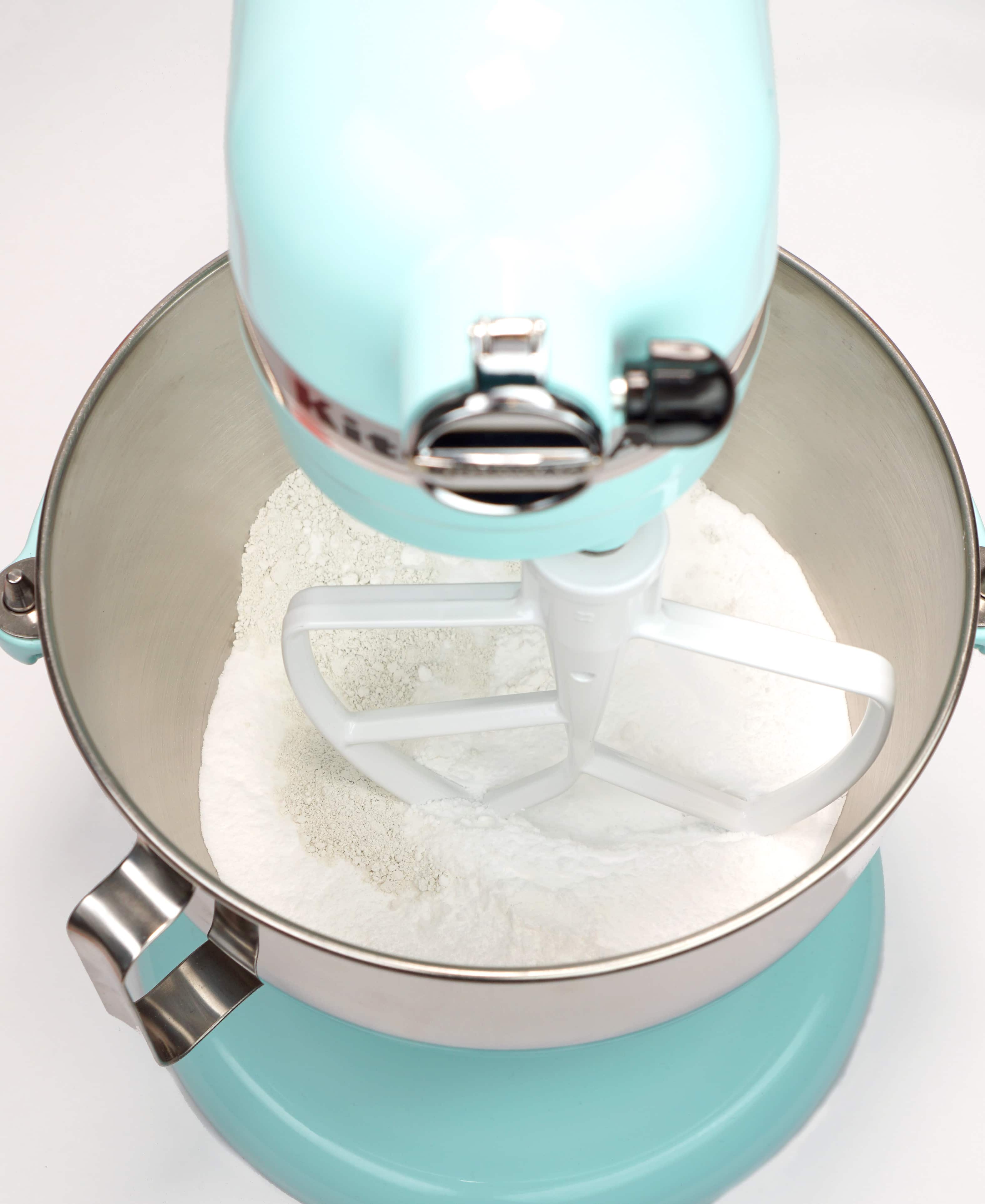 Bath bomb dry ingredients in aqua stand mixer