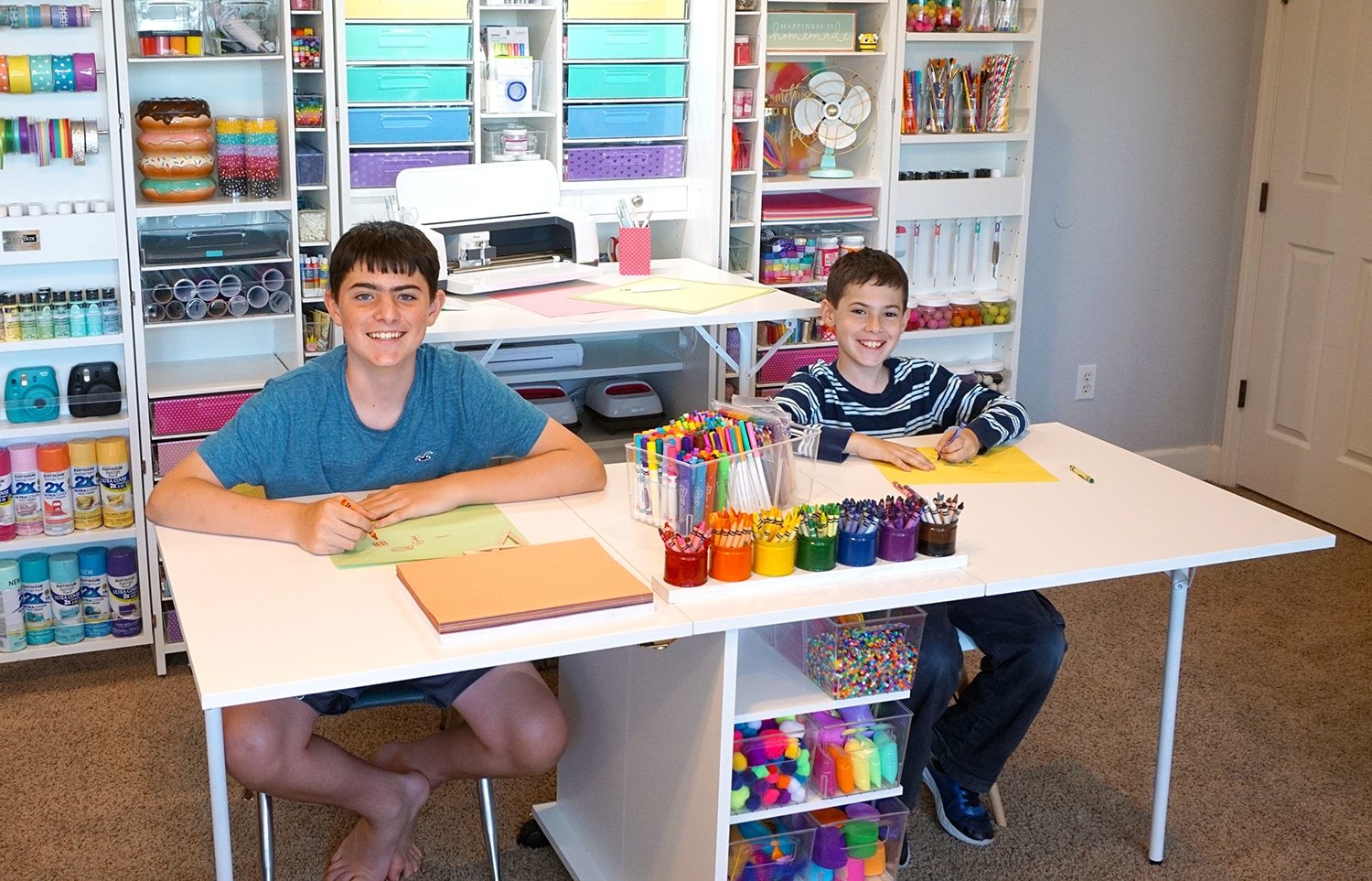 kids smiling while using dreamcart for crafts
