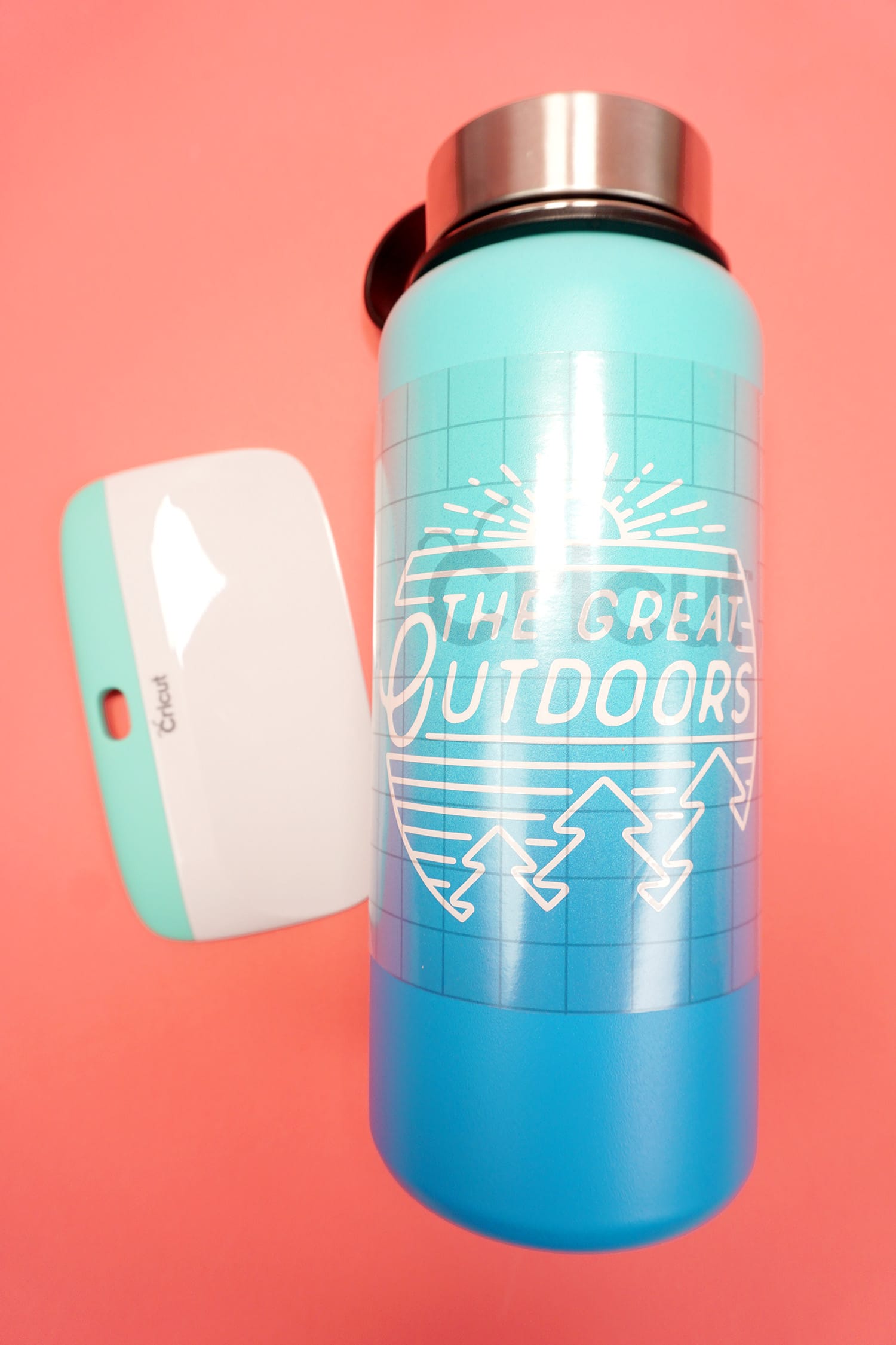 design overlayed onto water bottle and smoothing tool
