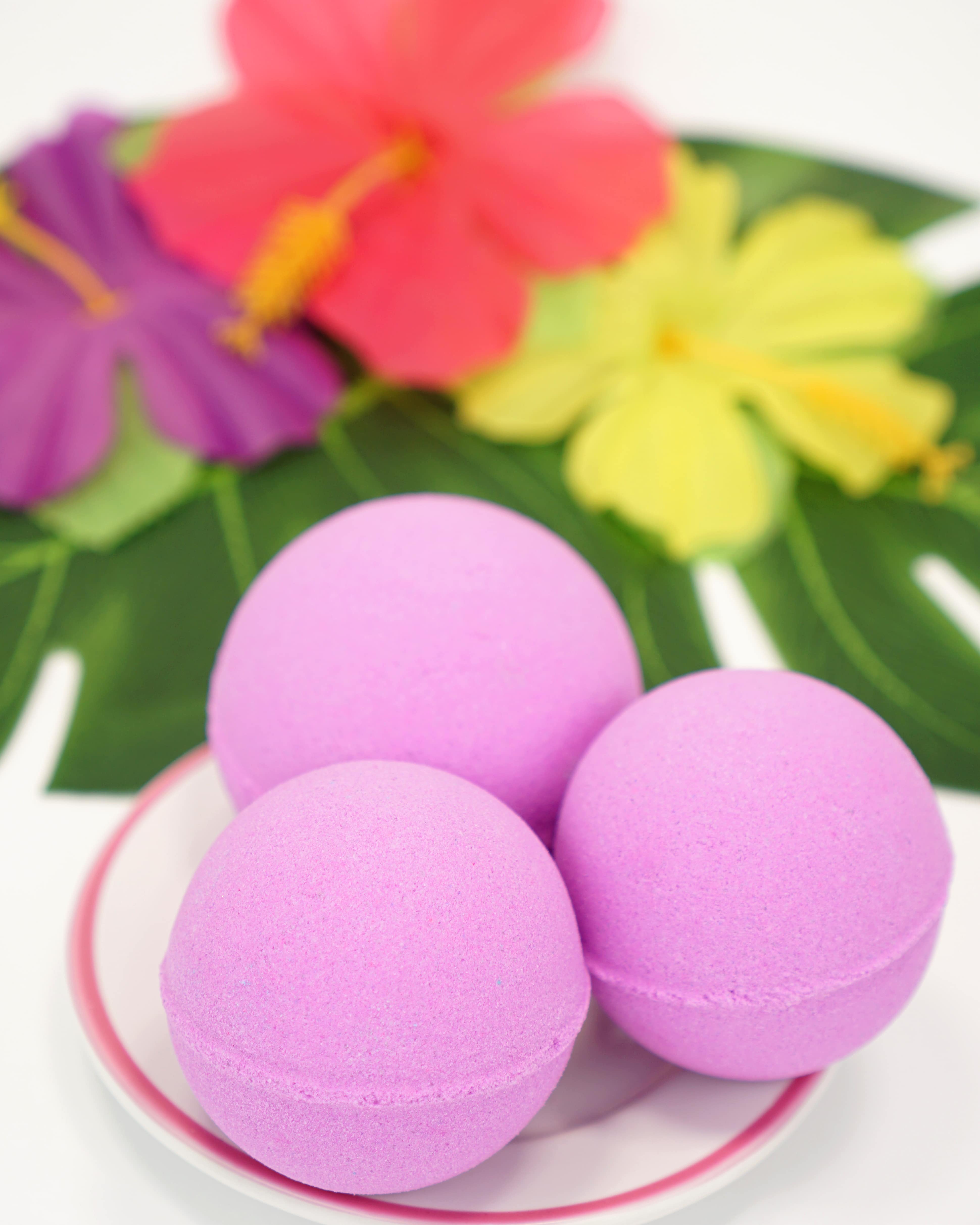 purple bath bombs on floral background