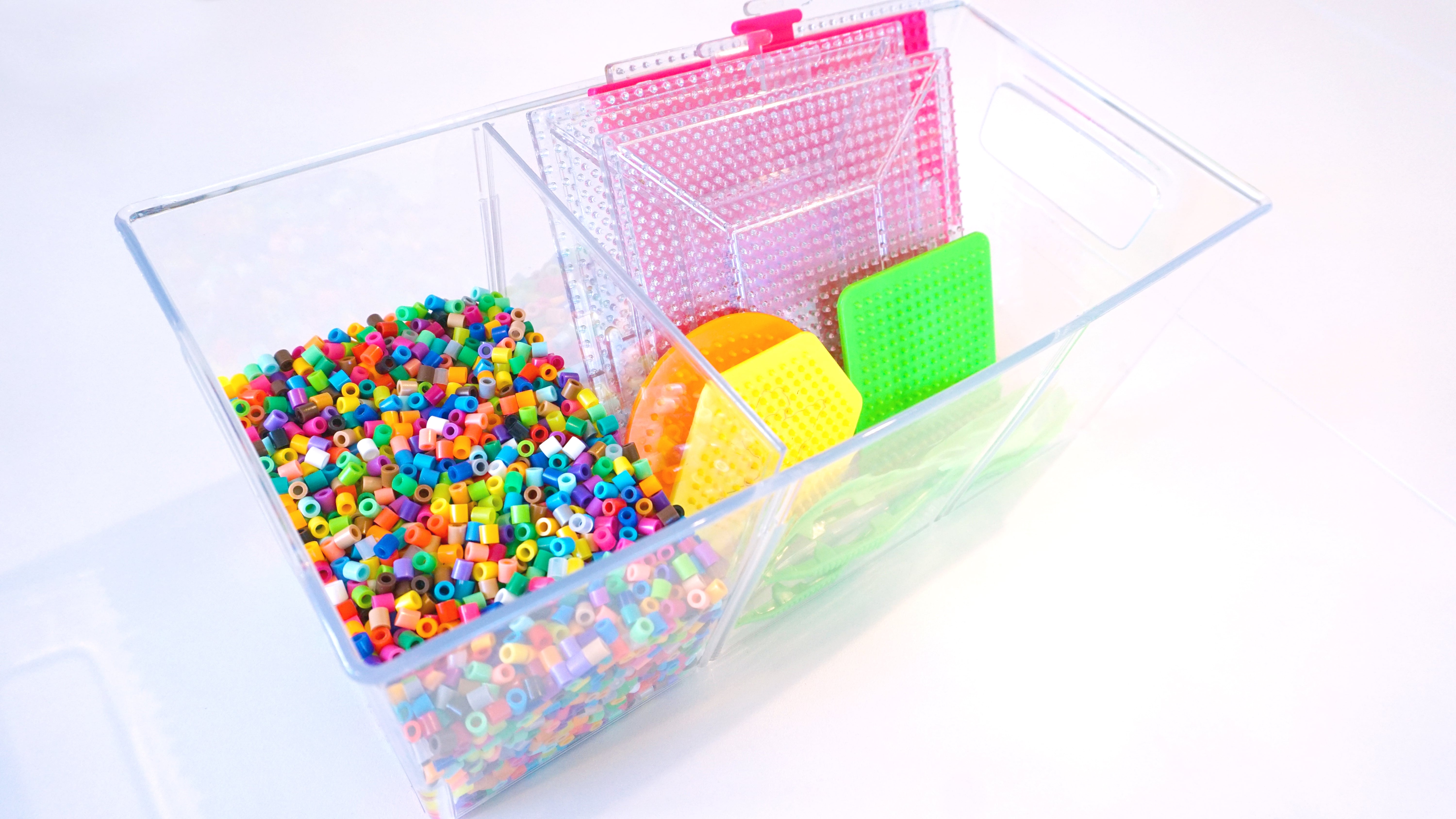 tub of perler beads and materials