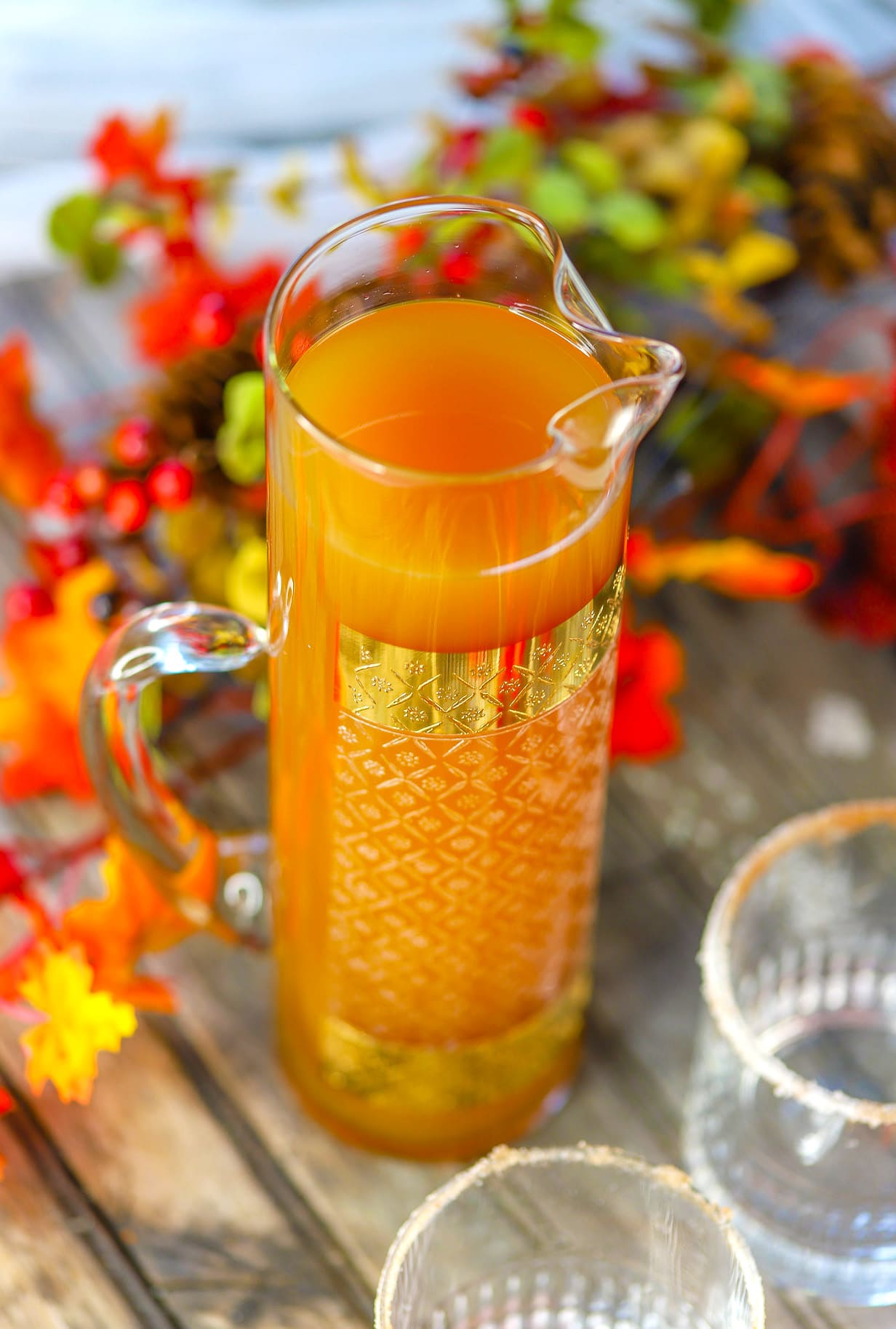 apple cider mimosa in tall pitcher