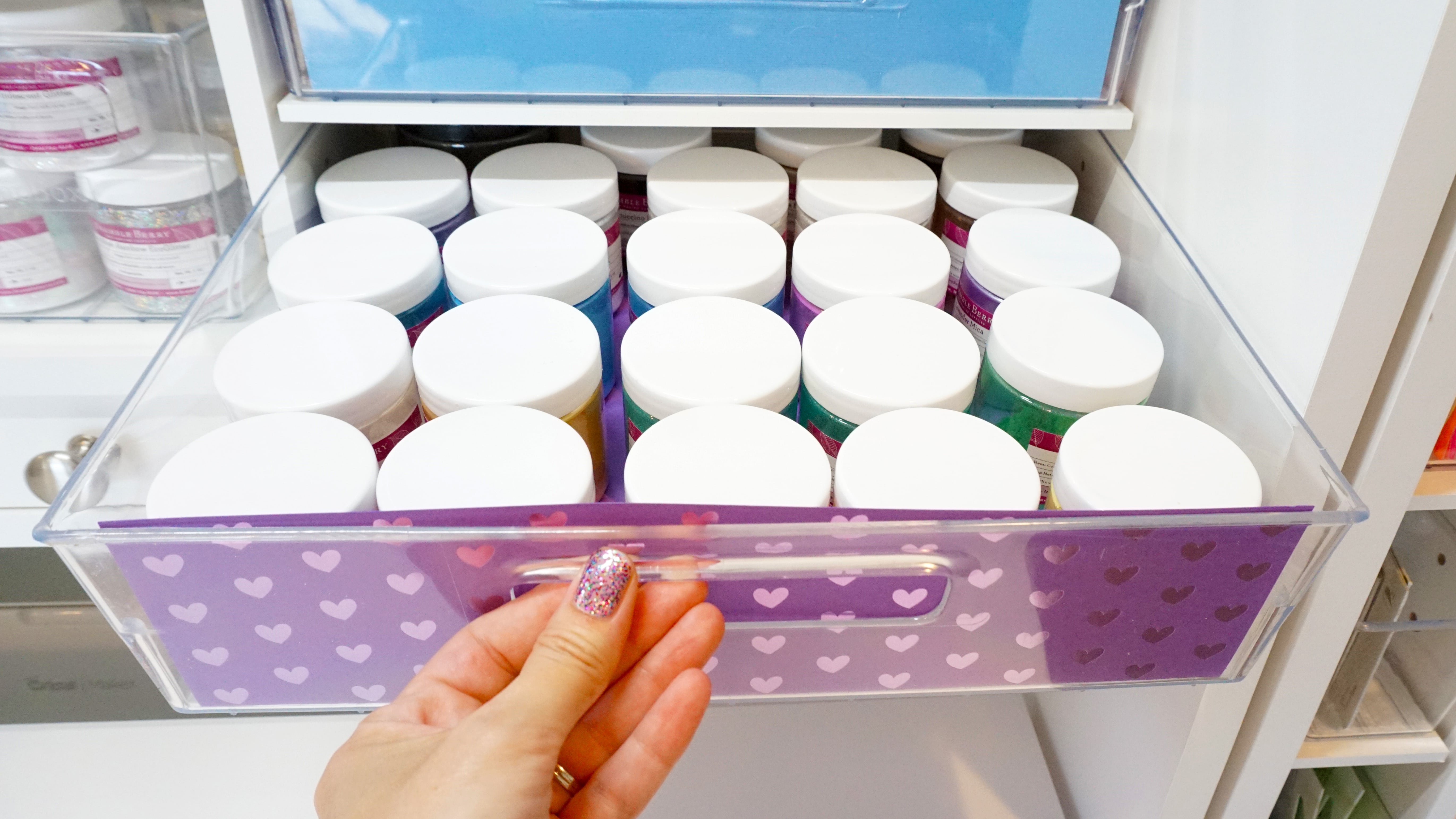 opening shelf of dreambox to reveal organized paints