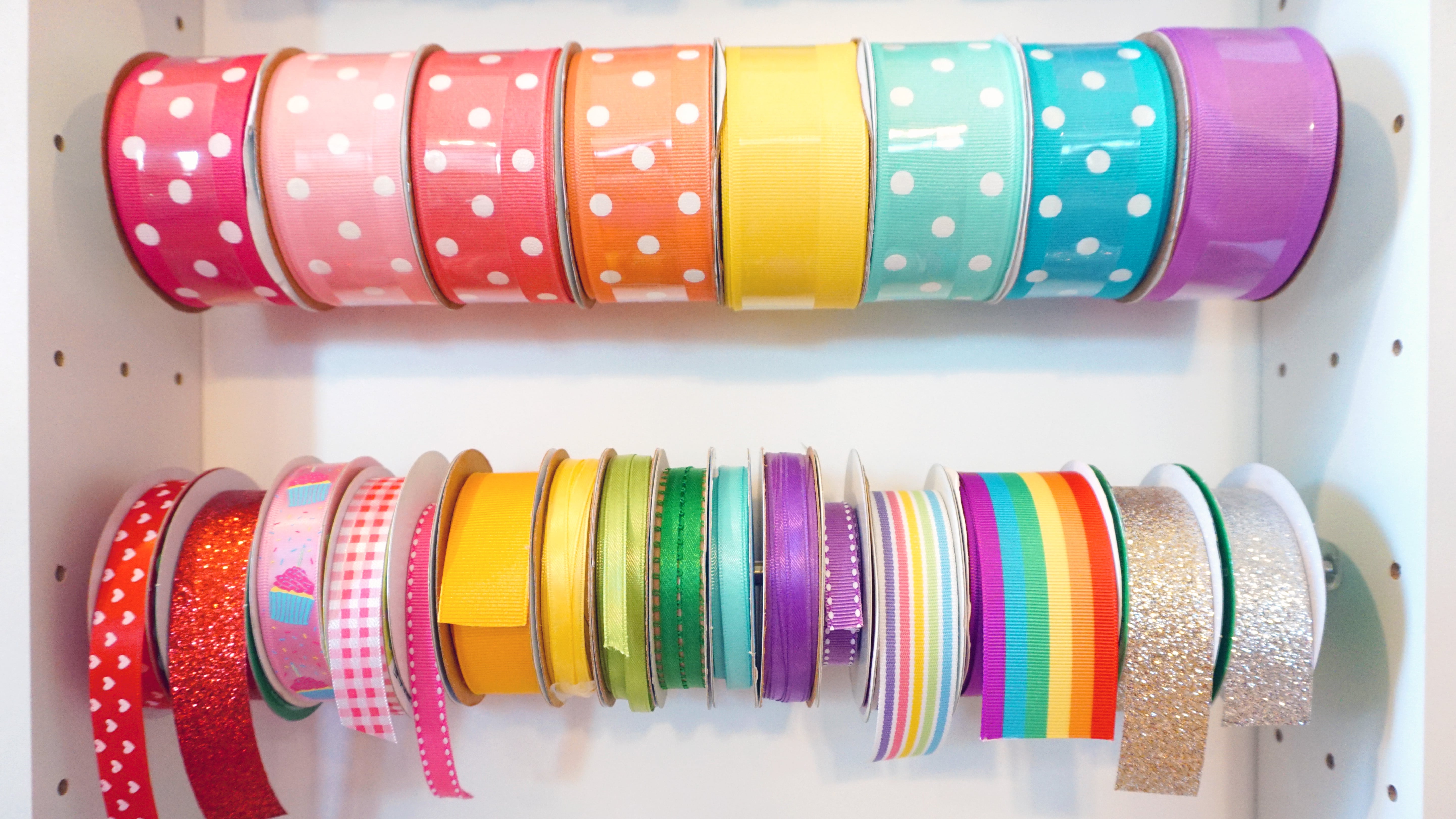 rows of rainbows of colored ribbons hanging in dreambox