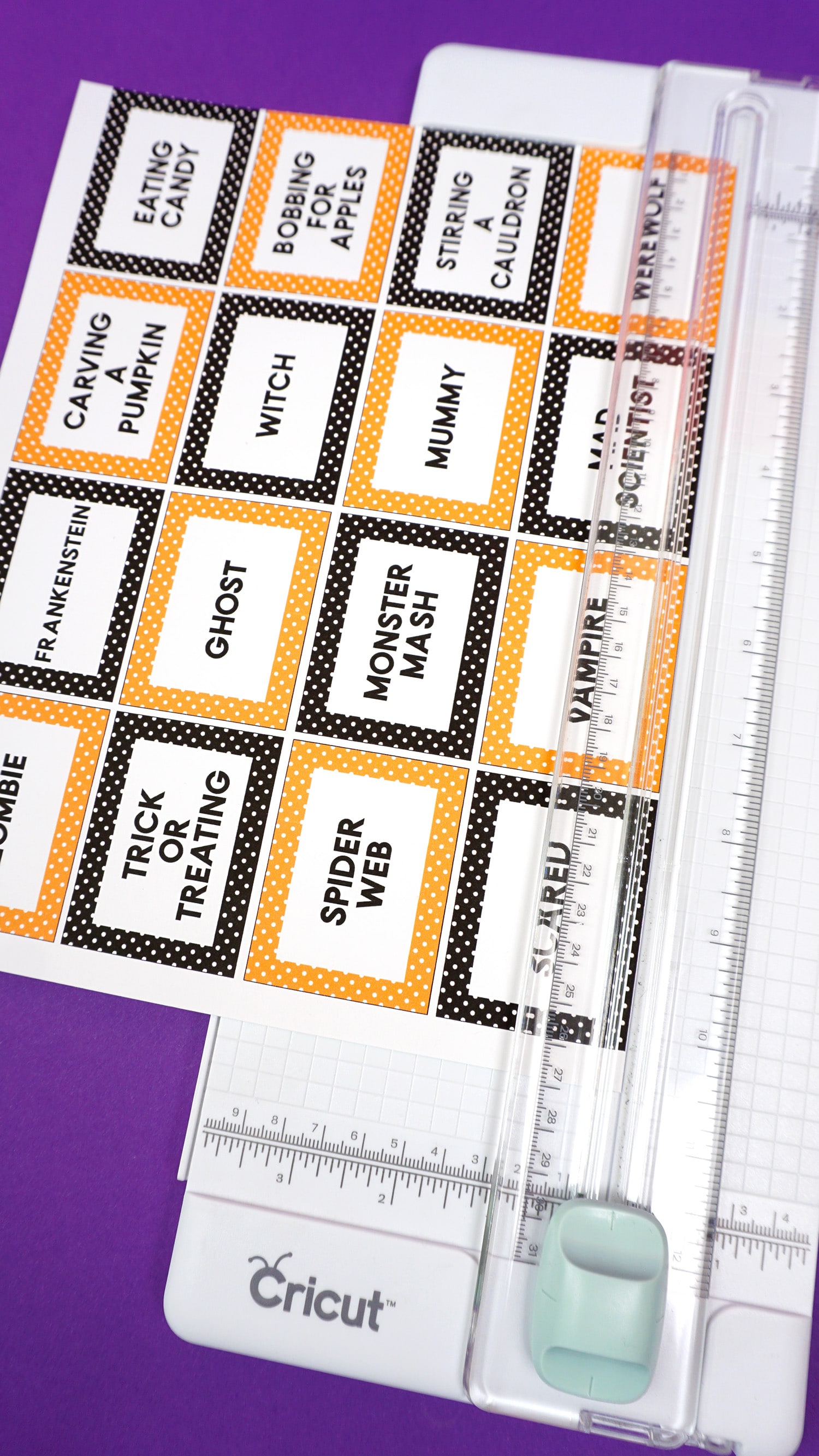 free printable halloween game cards being cut