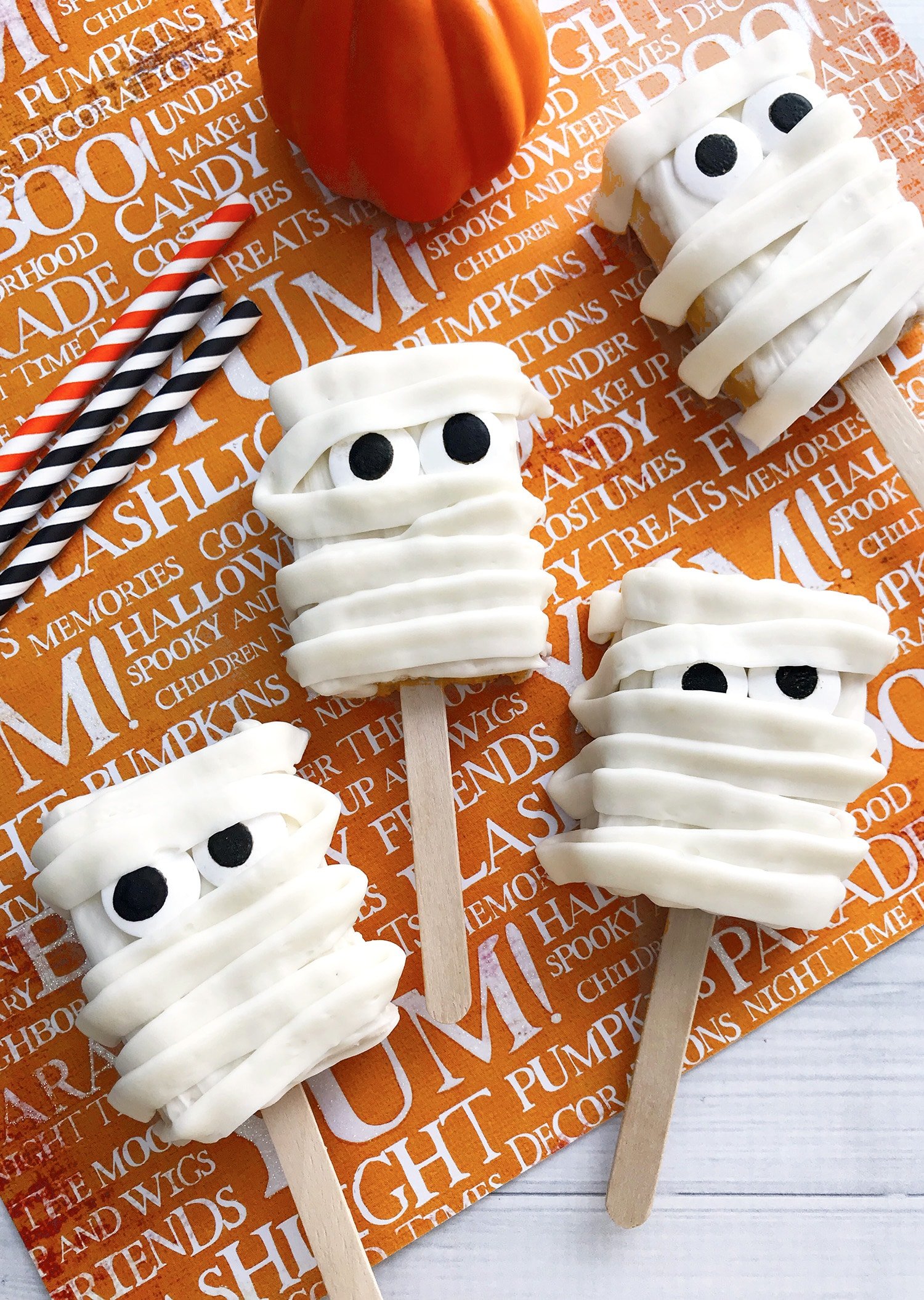 Mummy Rice Krispies Treats on an orange Halloween background