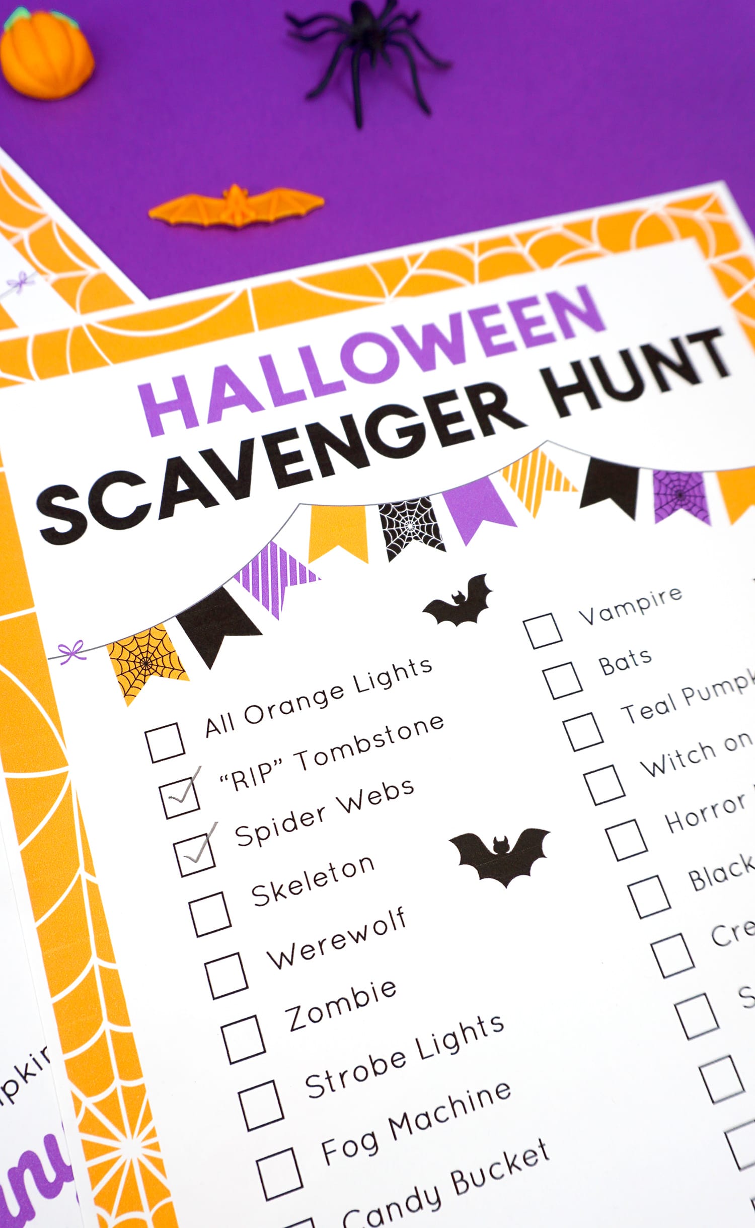 Close up of Halloween Scavenger Hunt checklist on a purple background
