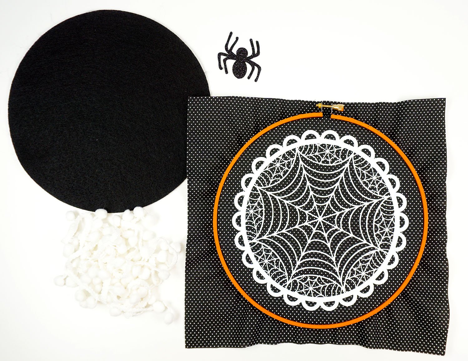hoop laid over spider web design 