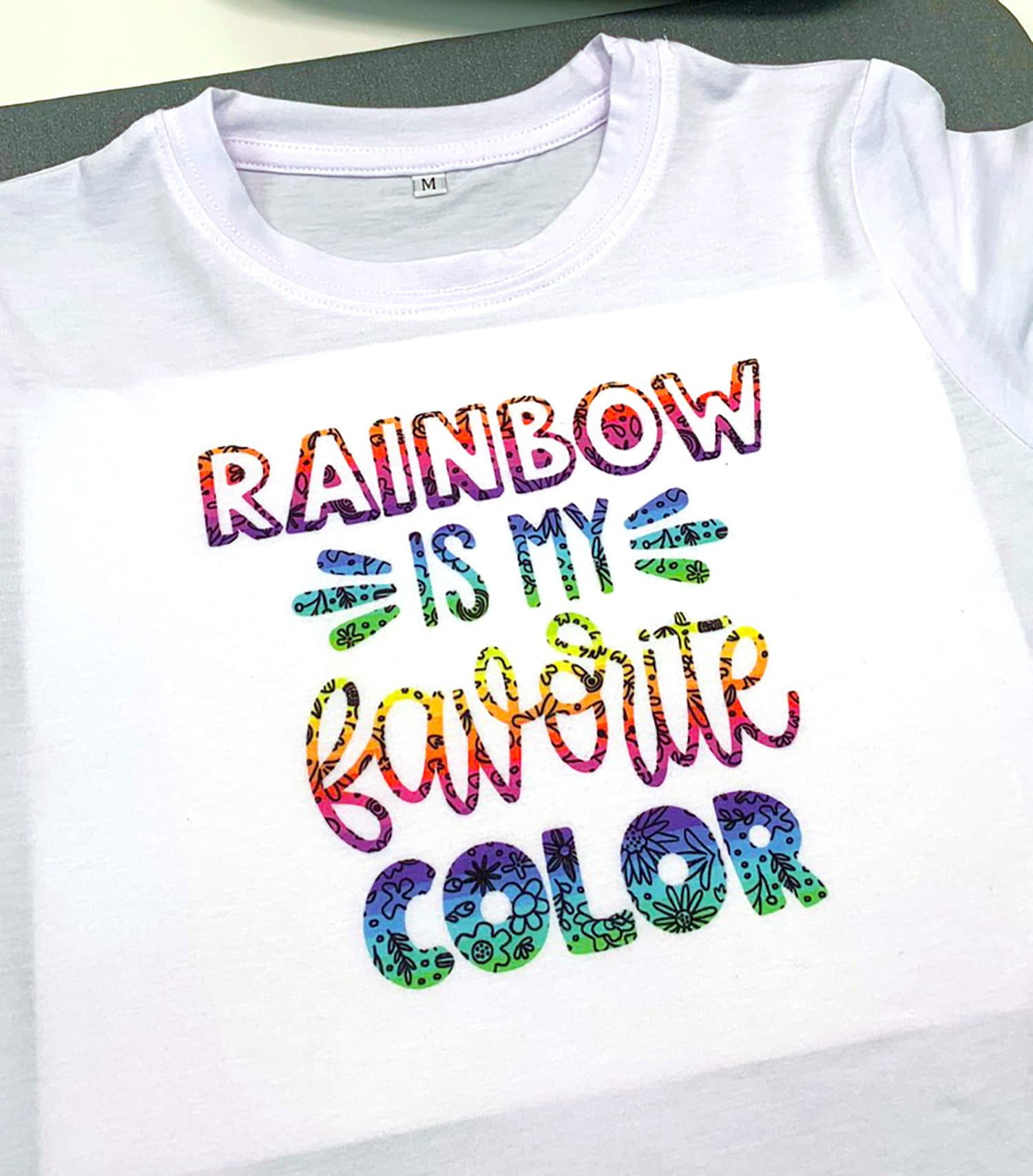 infusible ink shirt in rainbow font