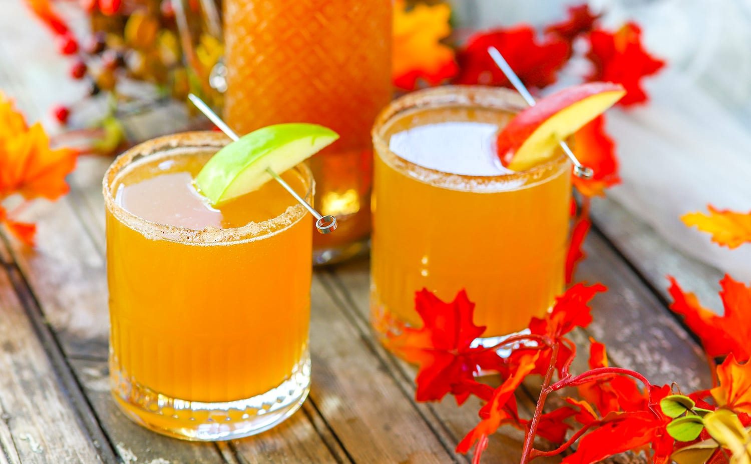 spiced apple cider mimosas with fall leaves