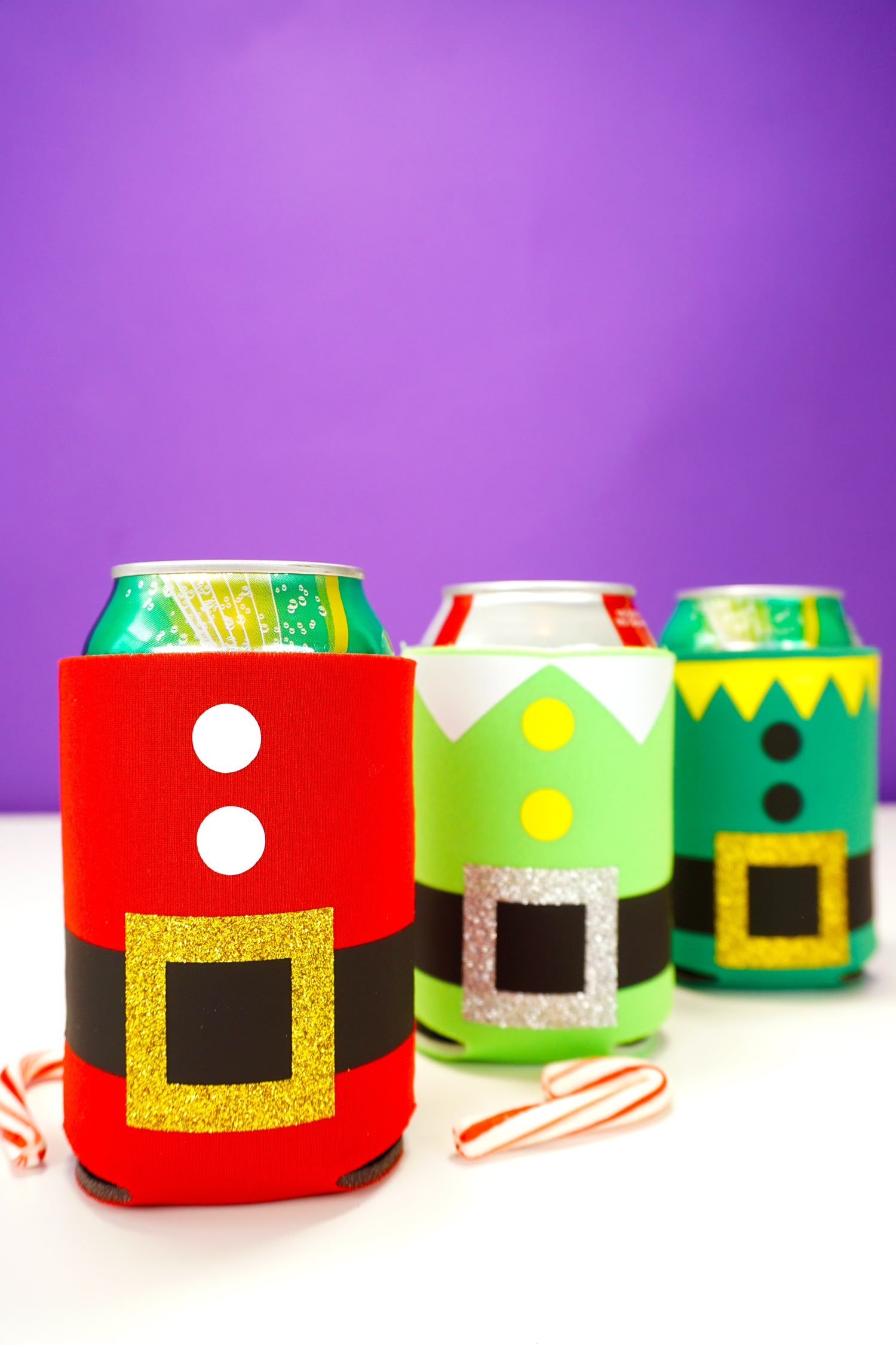 christmas drink koozies on cans of soda