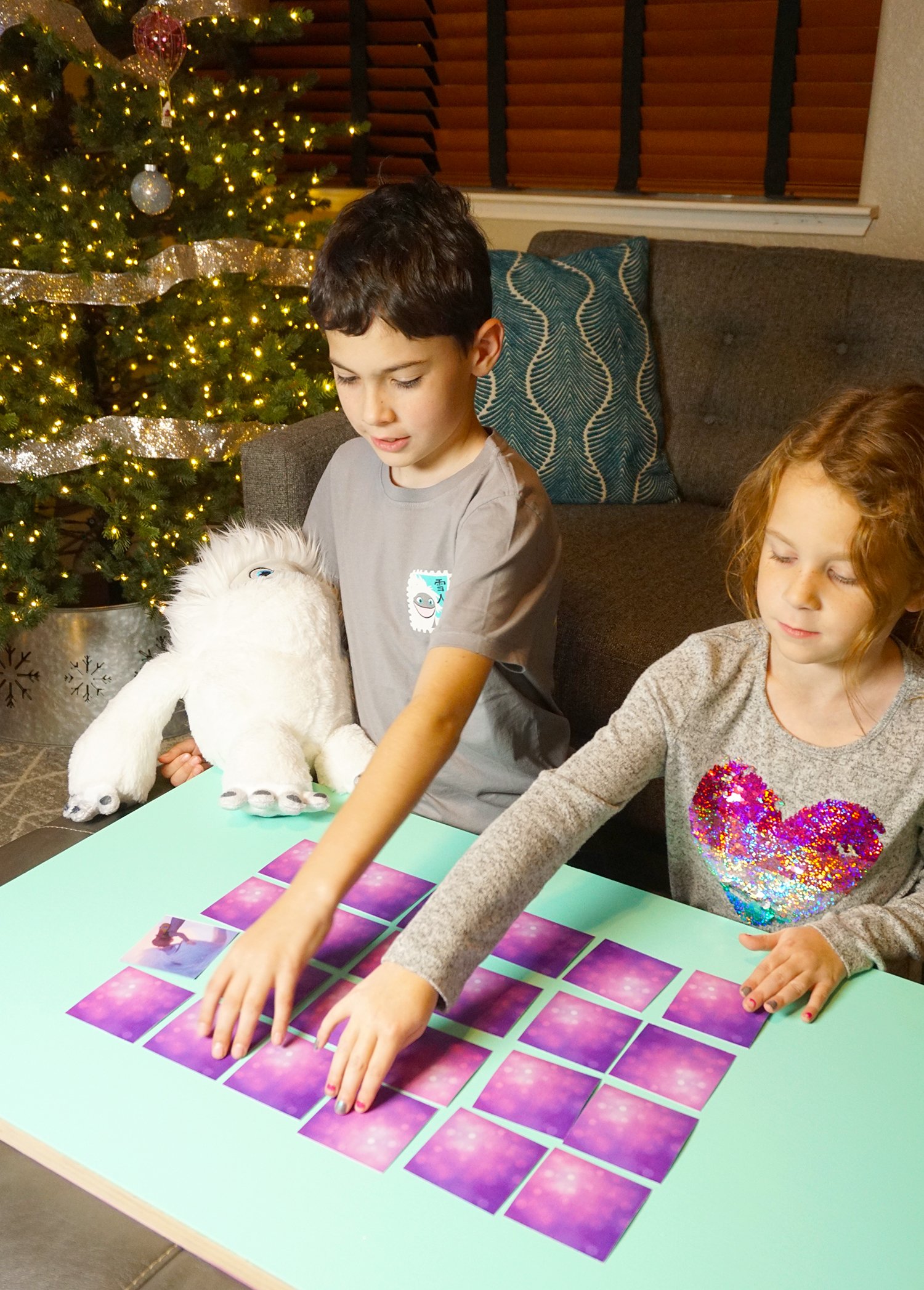 kids playing abominable memory match game 