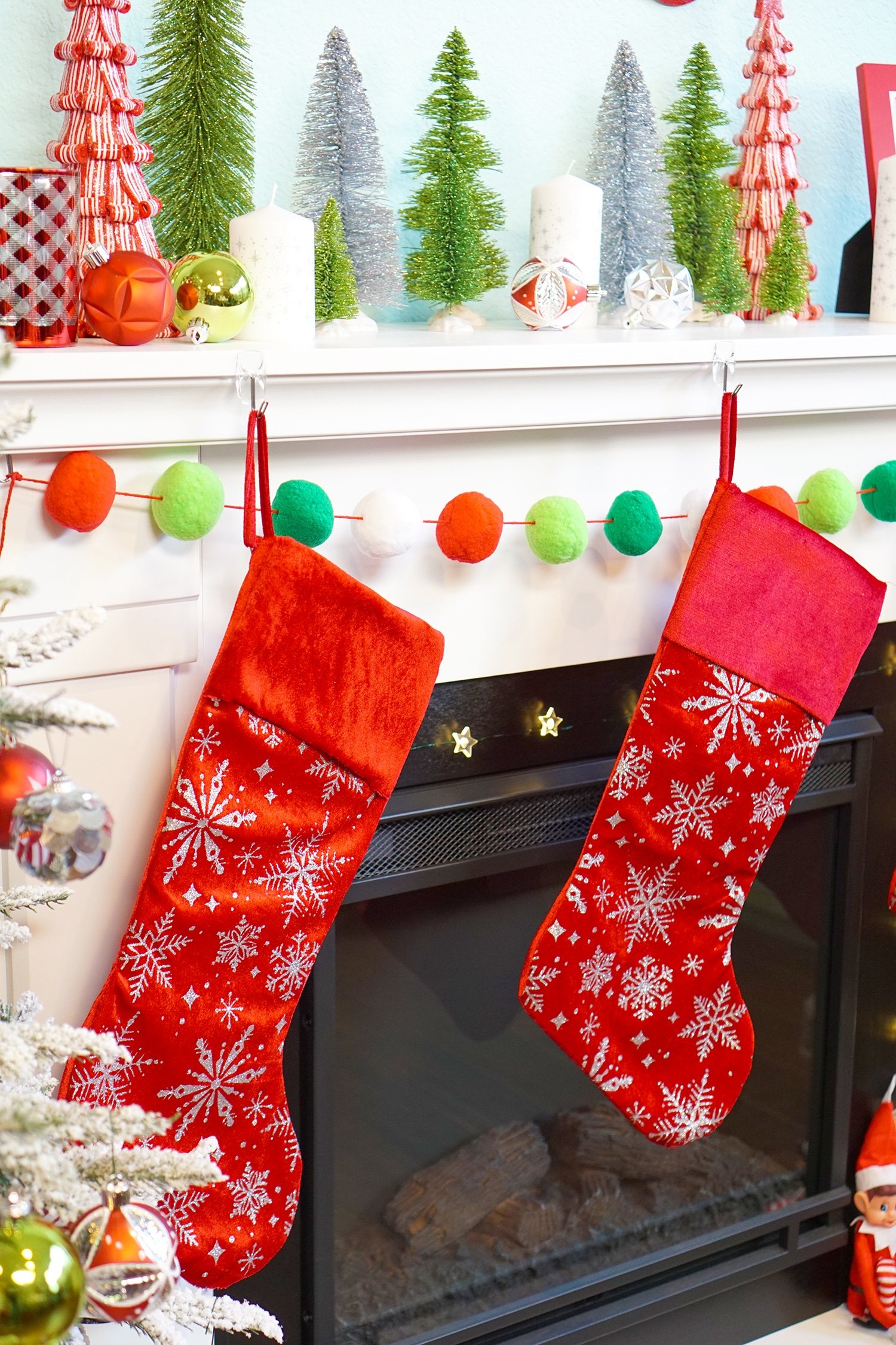 stocking and garland and christmas mantel decor