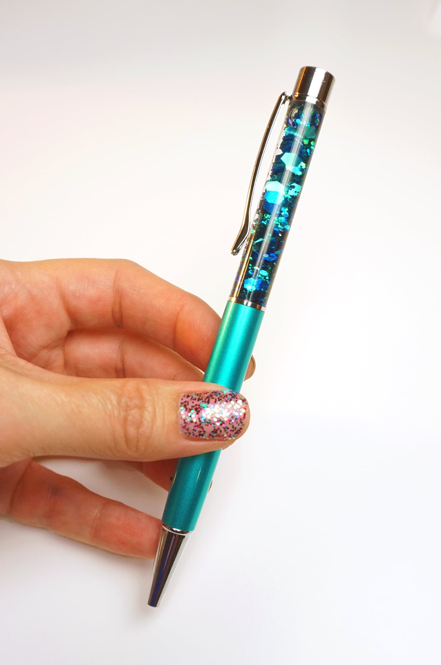 DIY glitter pen being held 