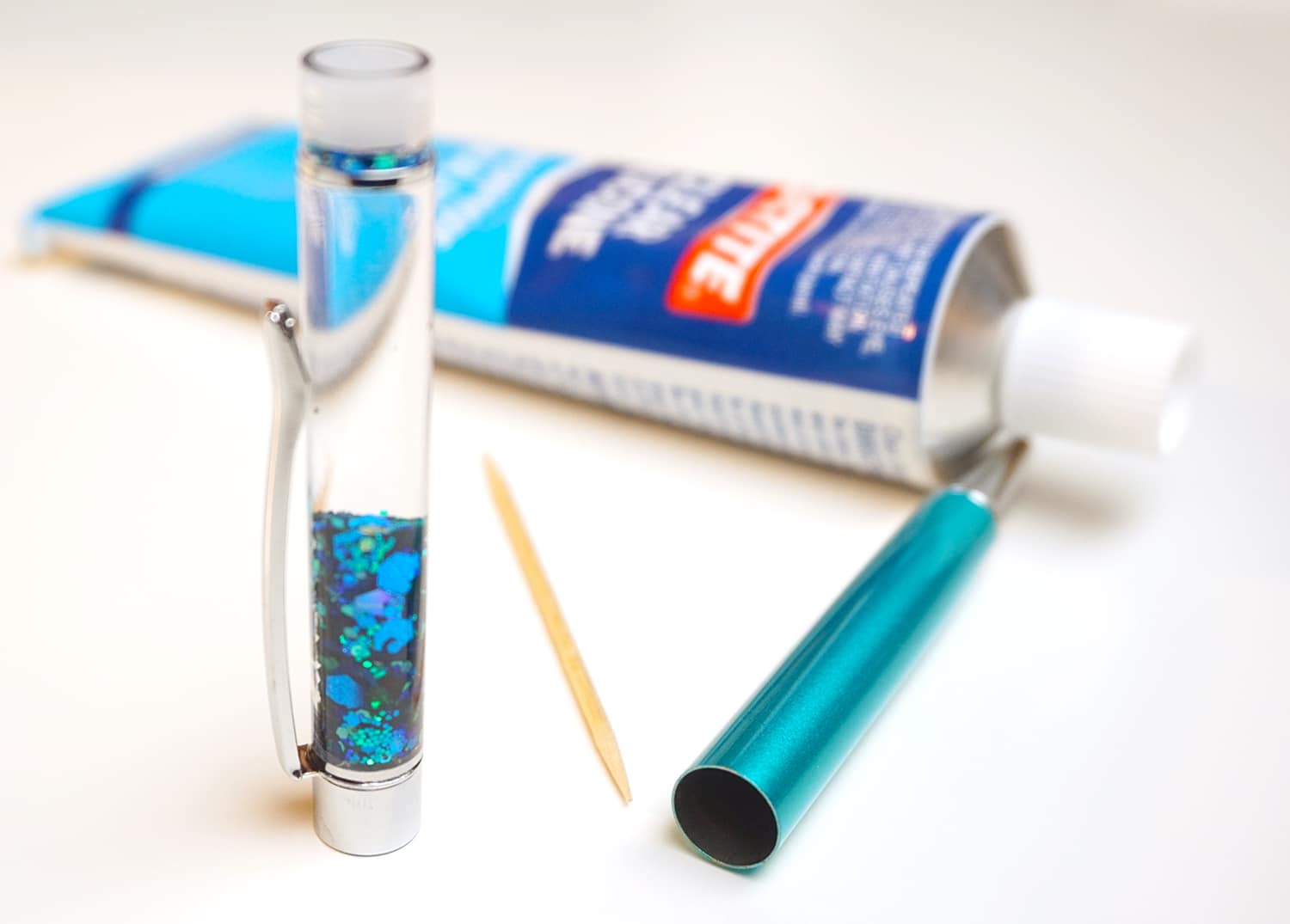 materials needed for glueing together glitter pen