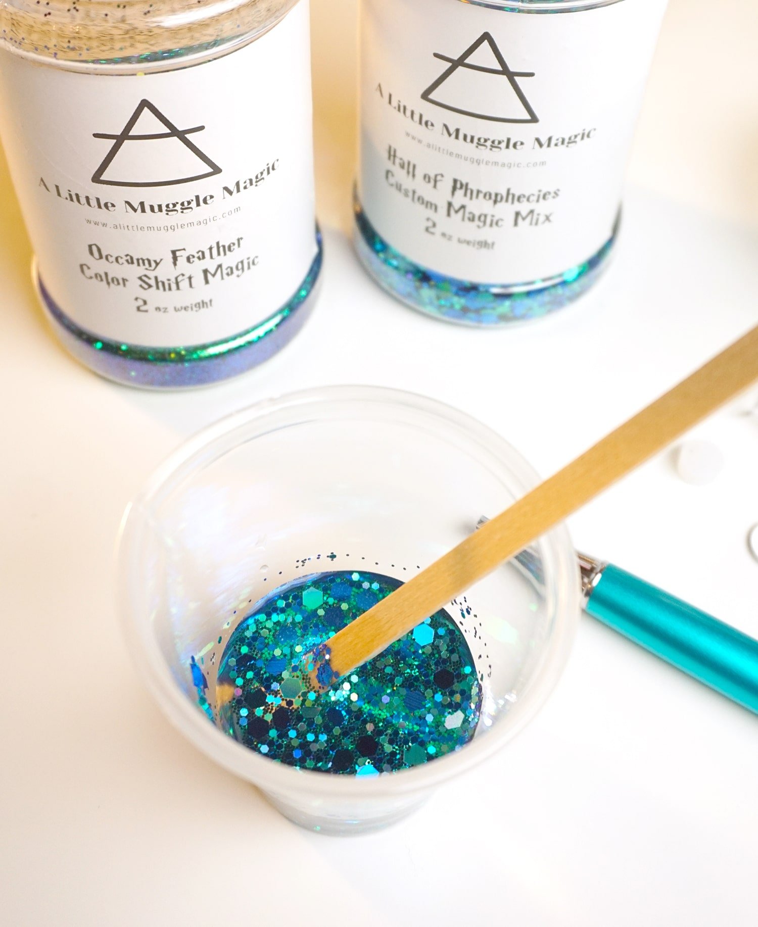 glitter solution being mixed with stick