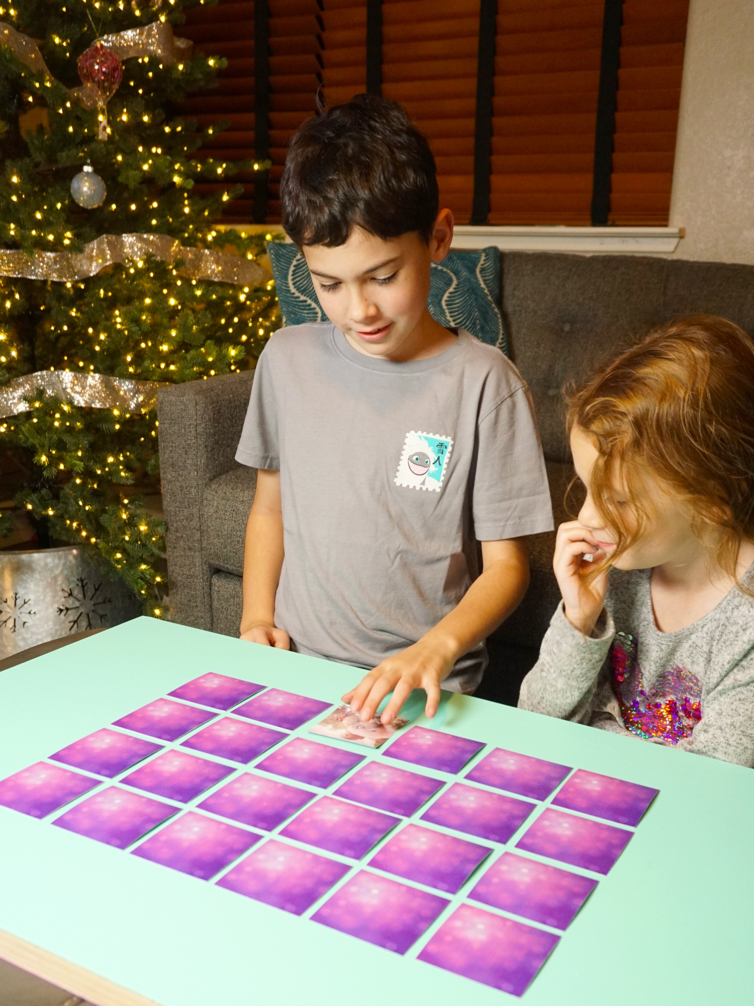 boy picking memory card while little girl watches