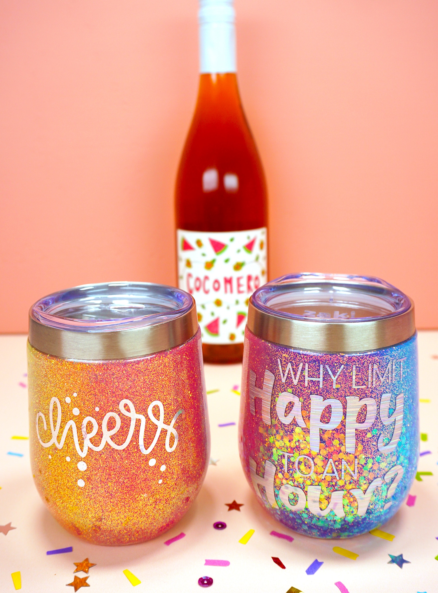 completed rainbow glitter wine tumblers made with cricut