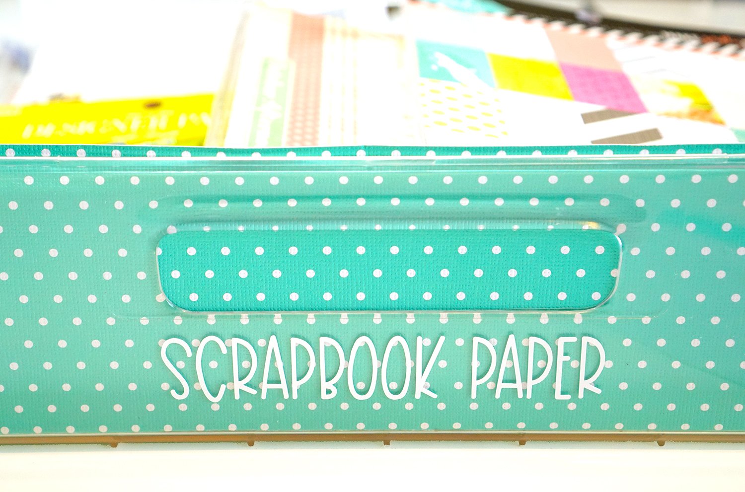 scrapbook paper drawer label on teal polka dot drawer