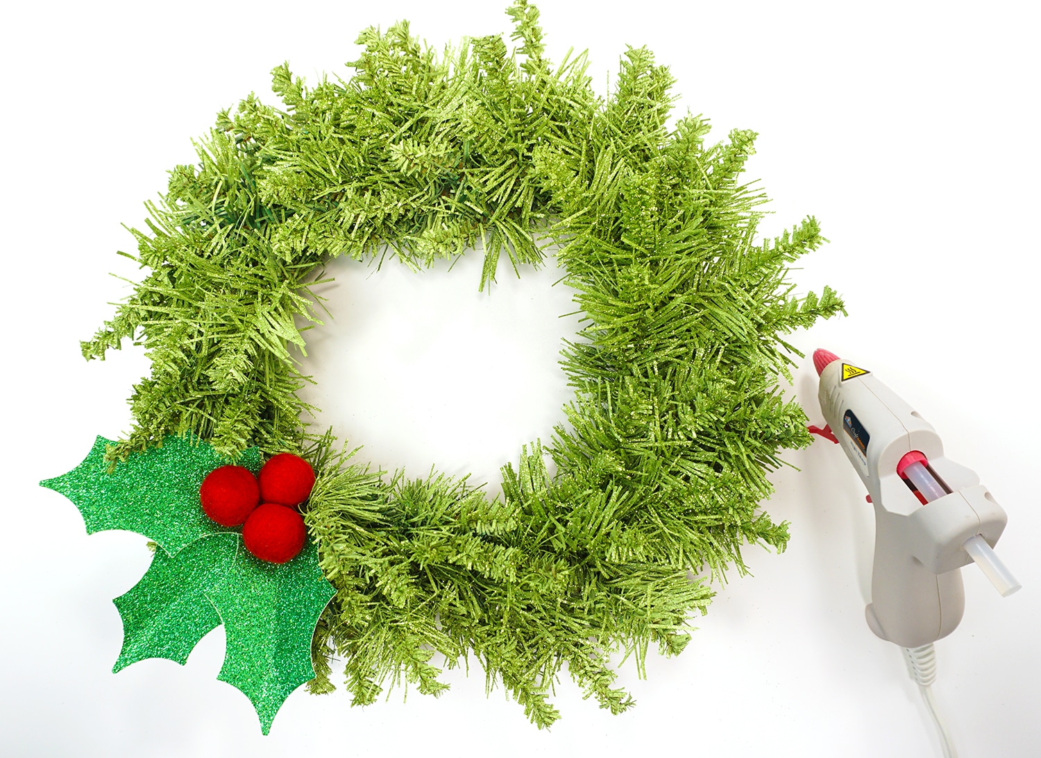 holly leaves glued to faux wreath