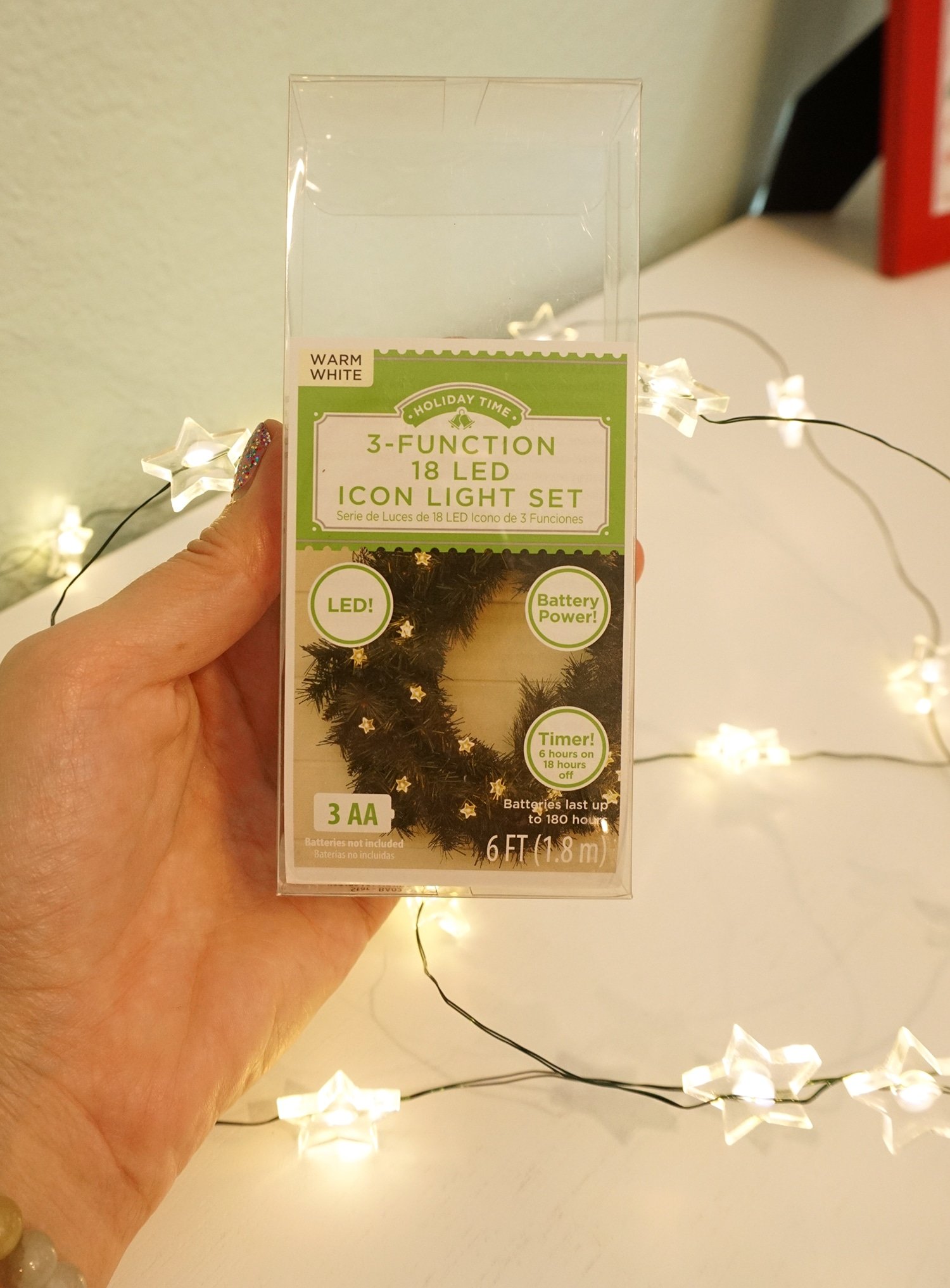 warm white star lights package held