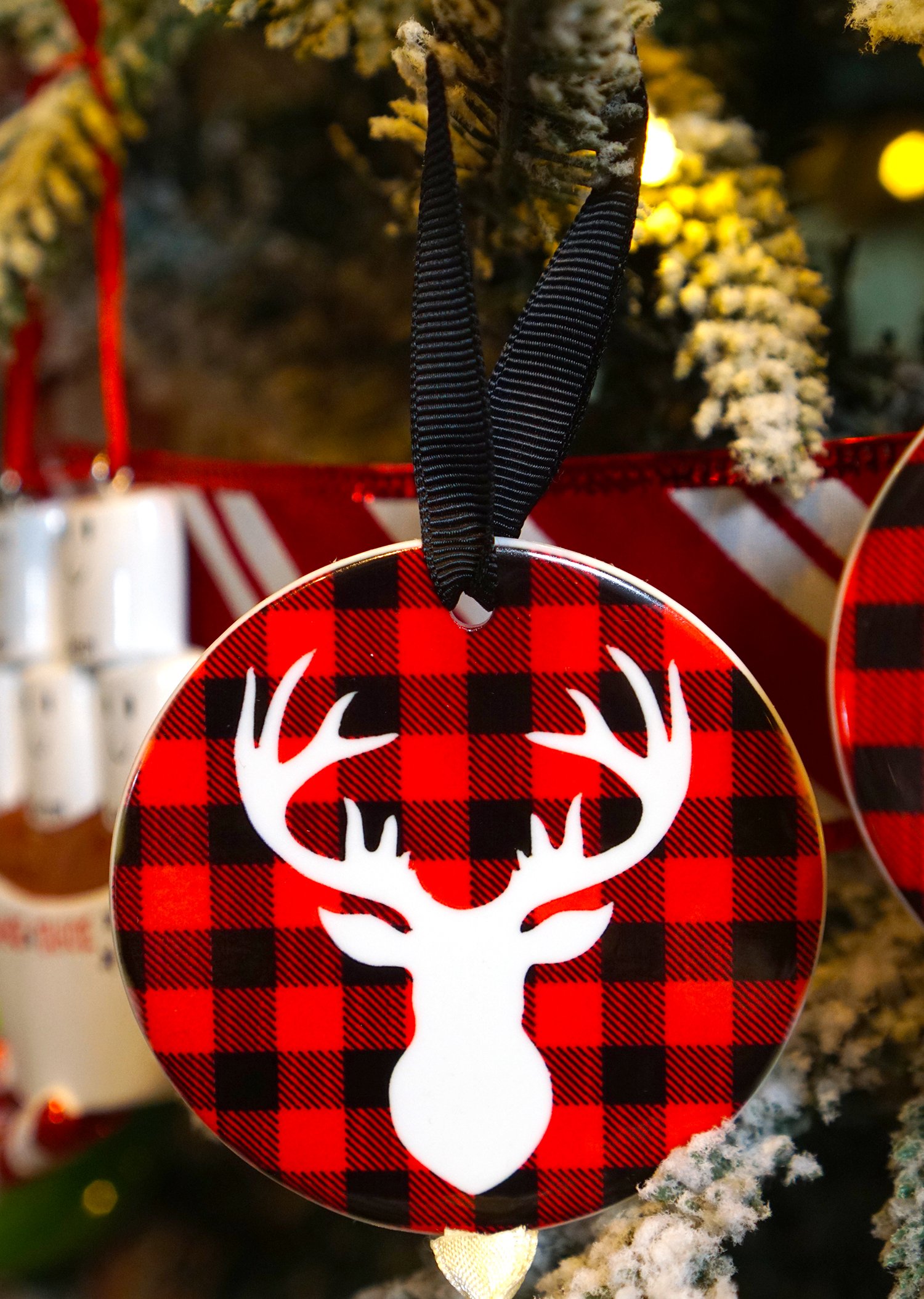 buffalo plaid christmas ornament with deer head on it