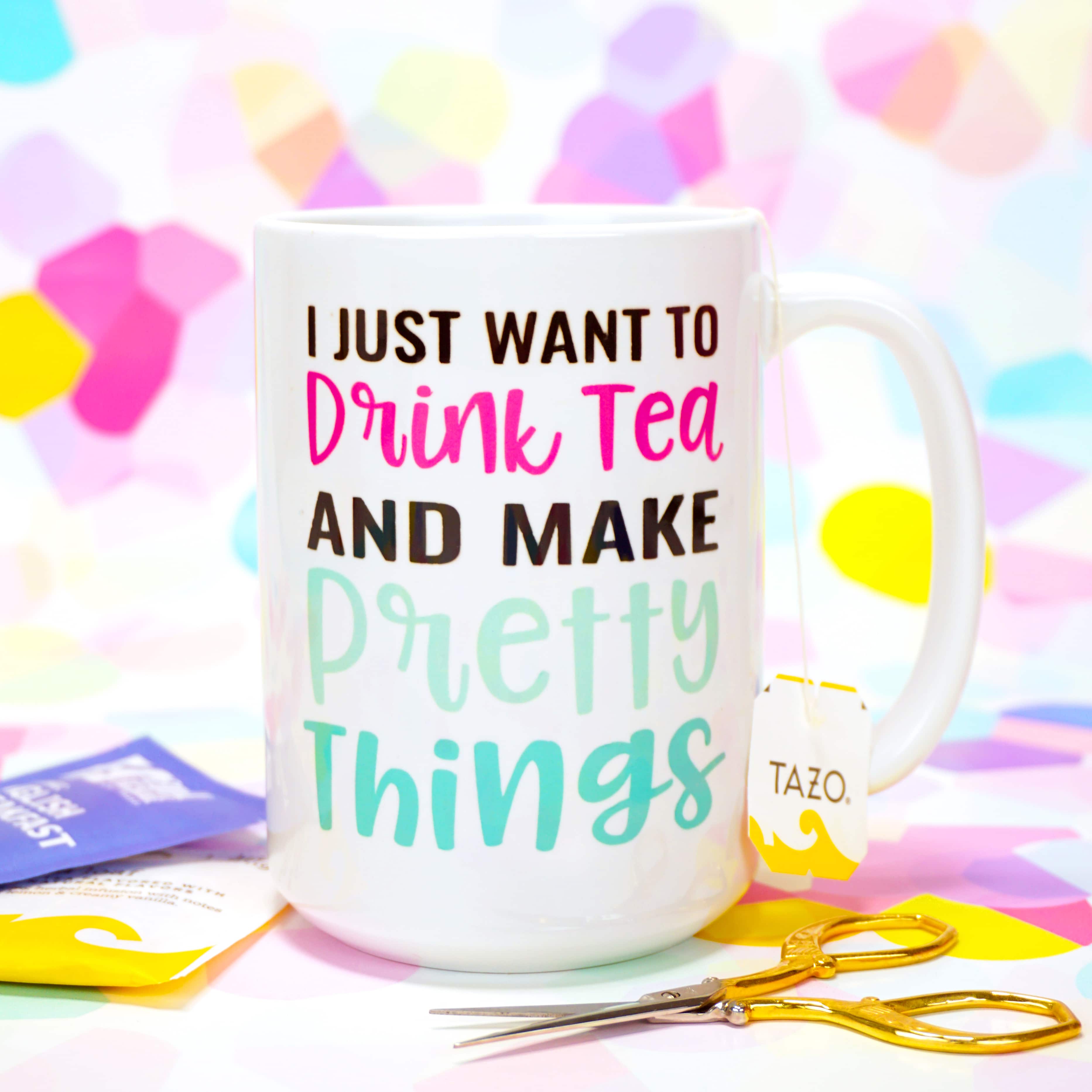 "I Just Want to Drink Tea and Make Pretty Things" mug made with Cricut Infusible Ink on colorful background