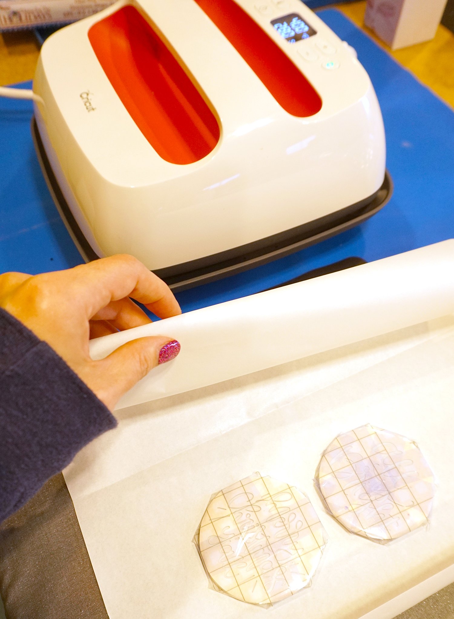 placing the ornaments between sheets of parchment paper