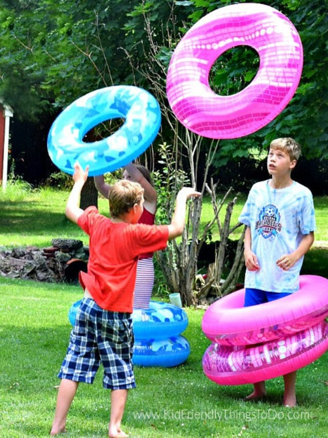 human ring toss game being played outside by kids with pool floating rings