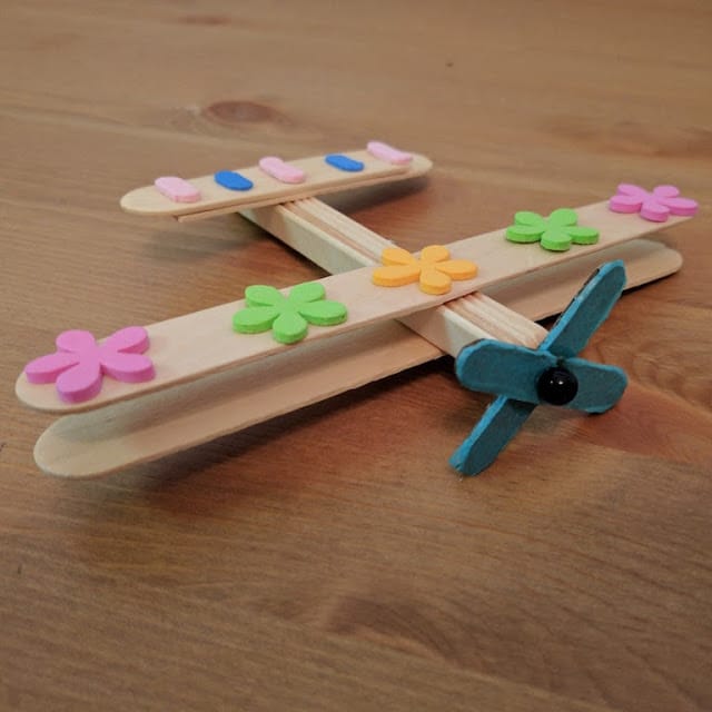 craft sticks made into an airplane