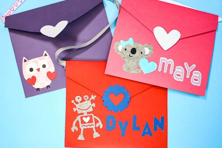 three envelopes with different valentines designs on them