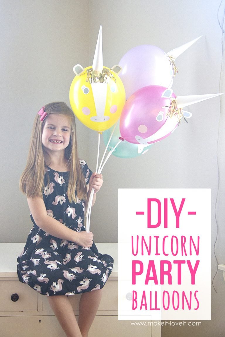 girl holding DIY unicorn party balloons 
