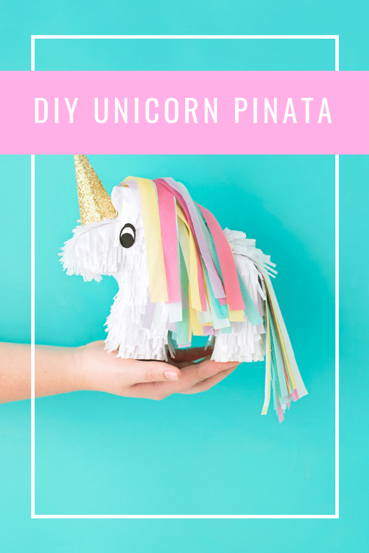 hand holding DIY unicorn pinata 