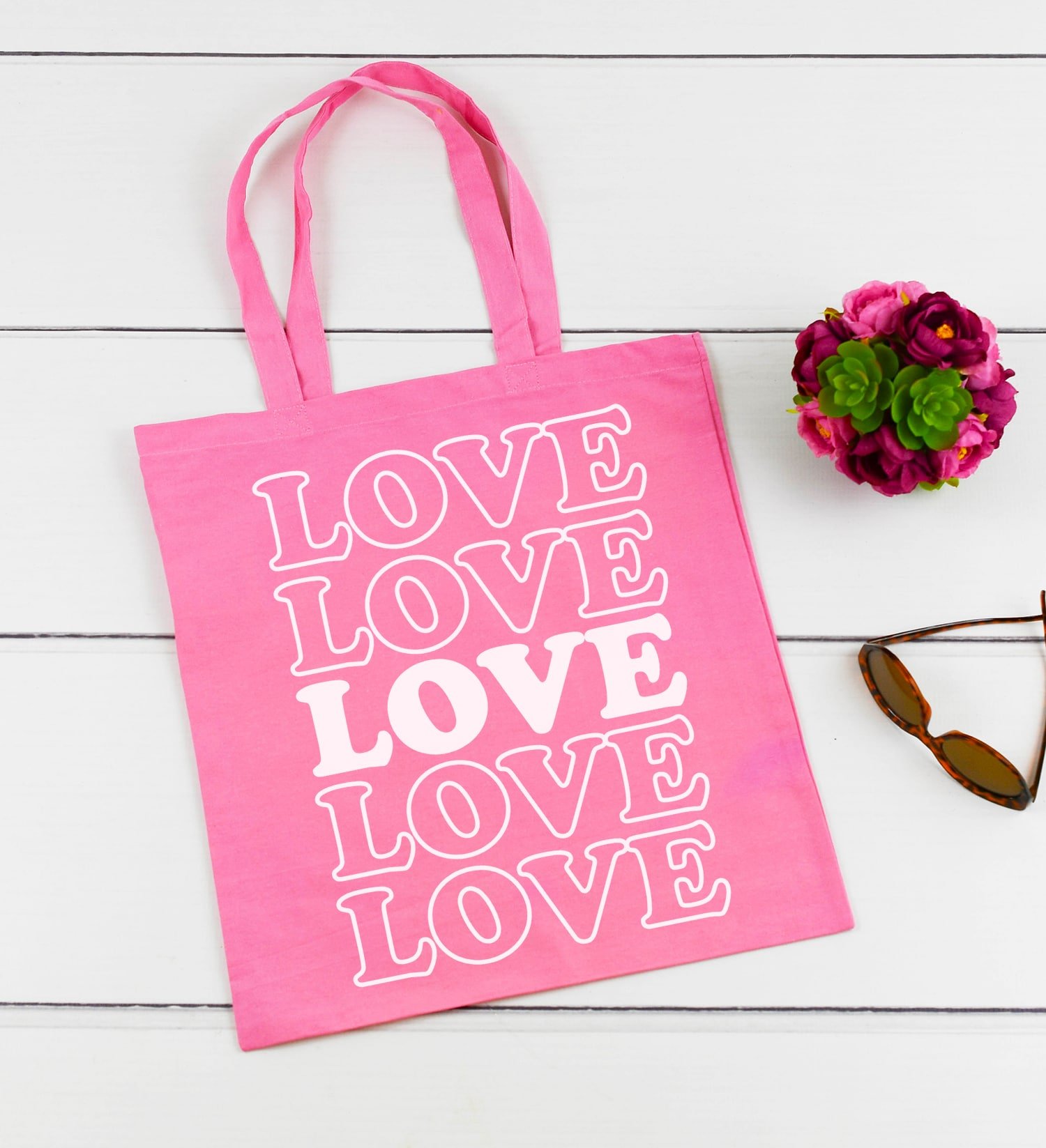 LOVE svg file on pink canvas tote bag