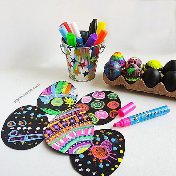 decorated black chalkboard eggs with pens
