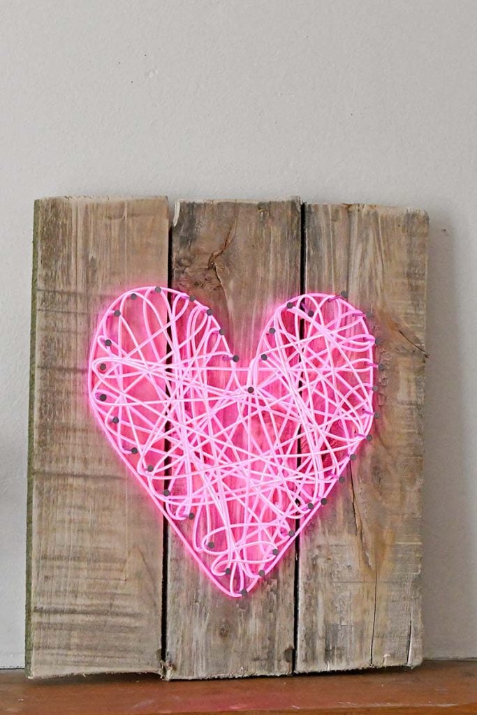 neon string wrapped heart sign
