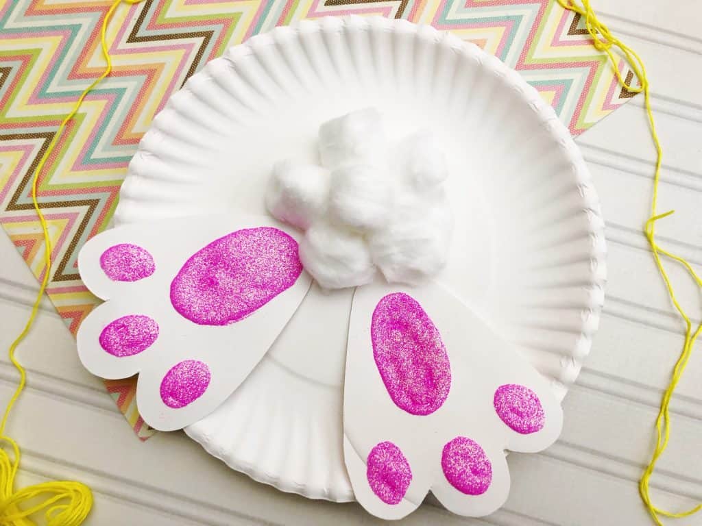 paper plate bunny behind with cotton tail and paper feet 