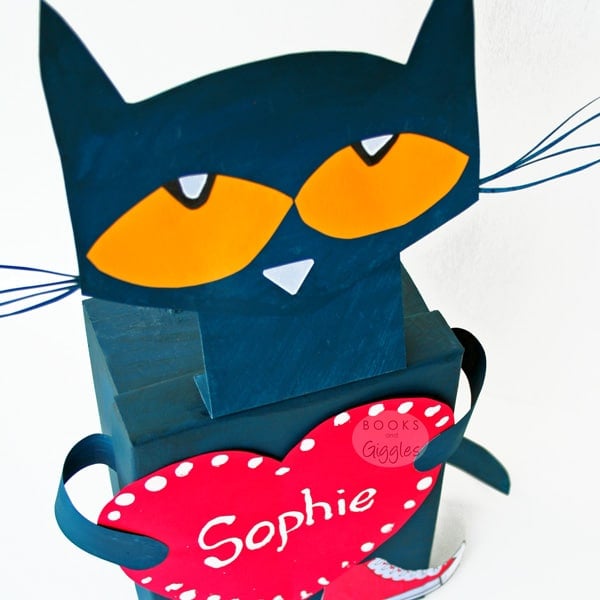 a paper bag with a black cat on it valentine box
