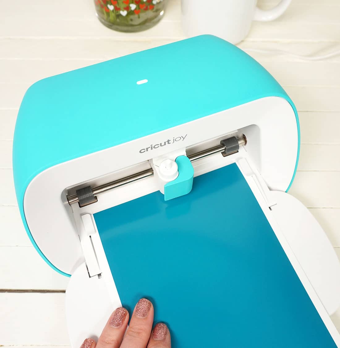 cricut joy with smart vinyl being loaded