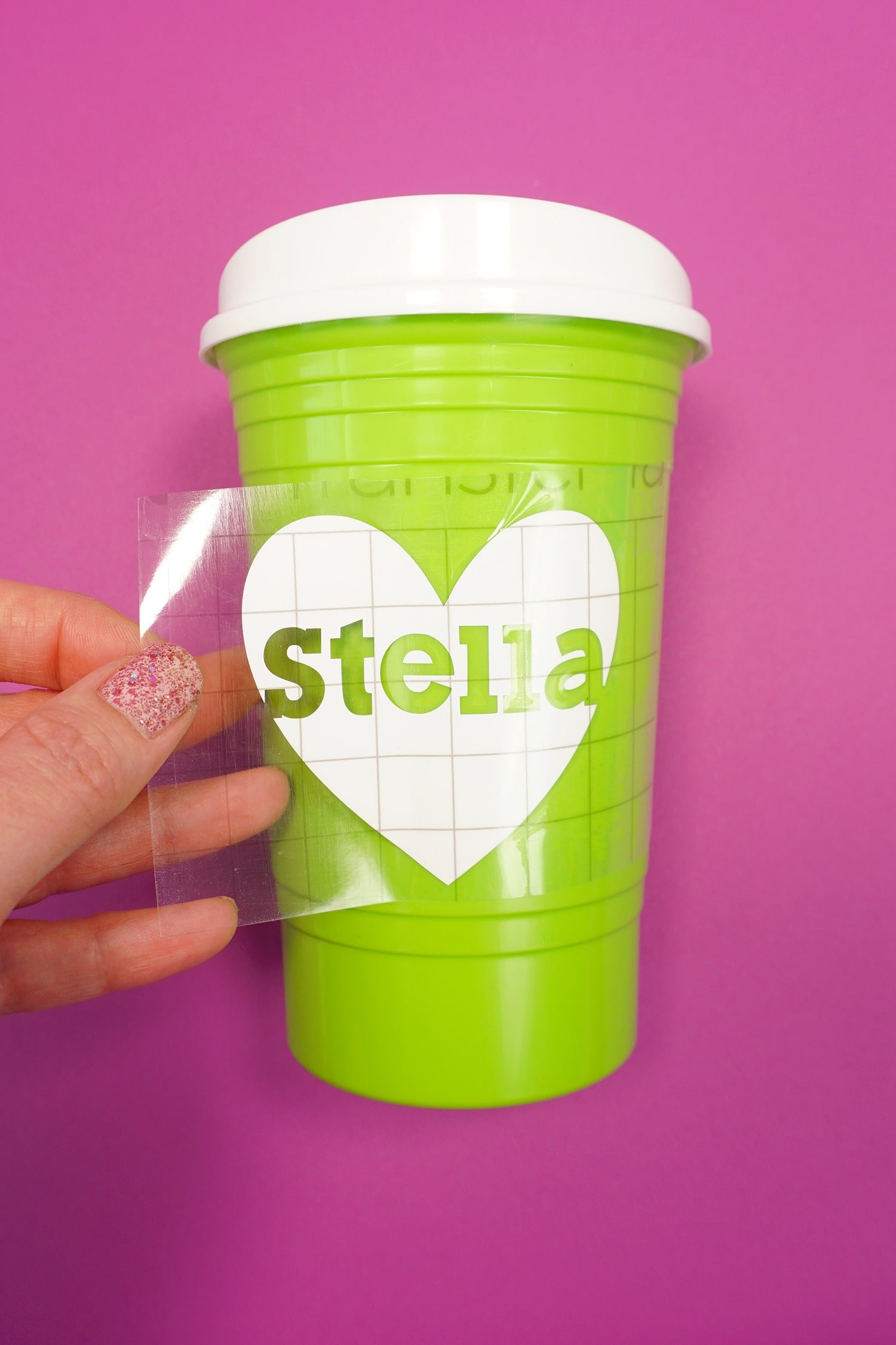 peeling and revealing personalized name Stella on white heart design on party cup