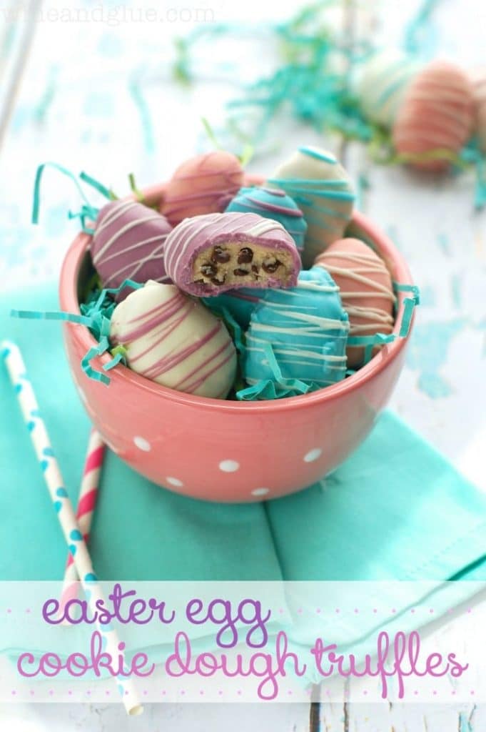 cookie dough truffles in a bowl with straws