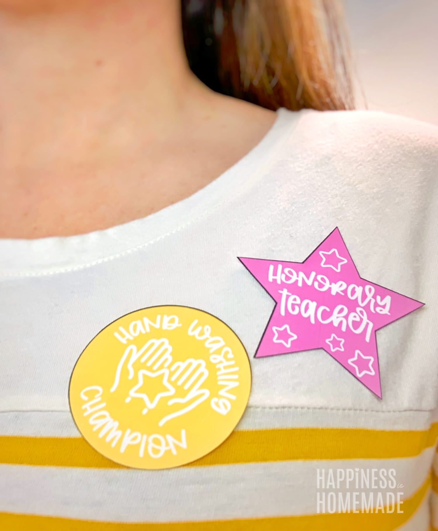 girl wearing printable reward stickers on shirt