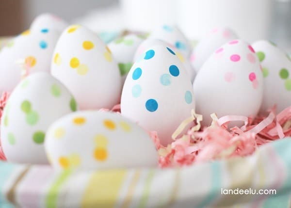 dot colored easter eggs in basket 