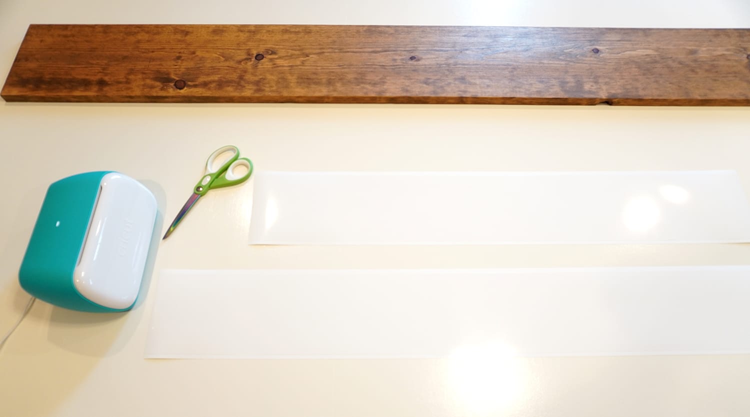 scissors and materials with long wooden board