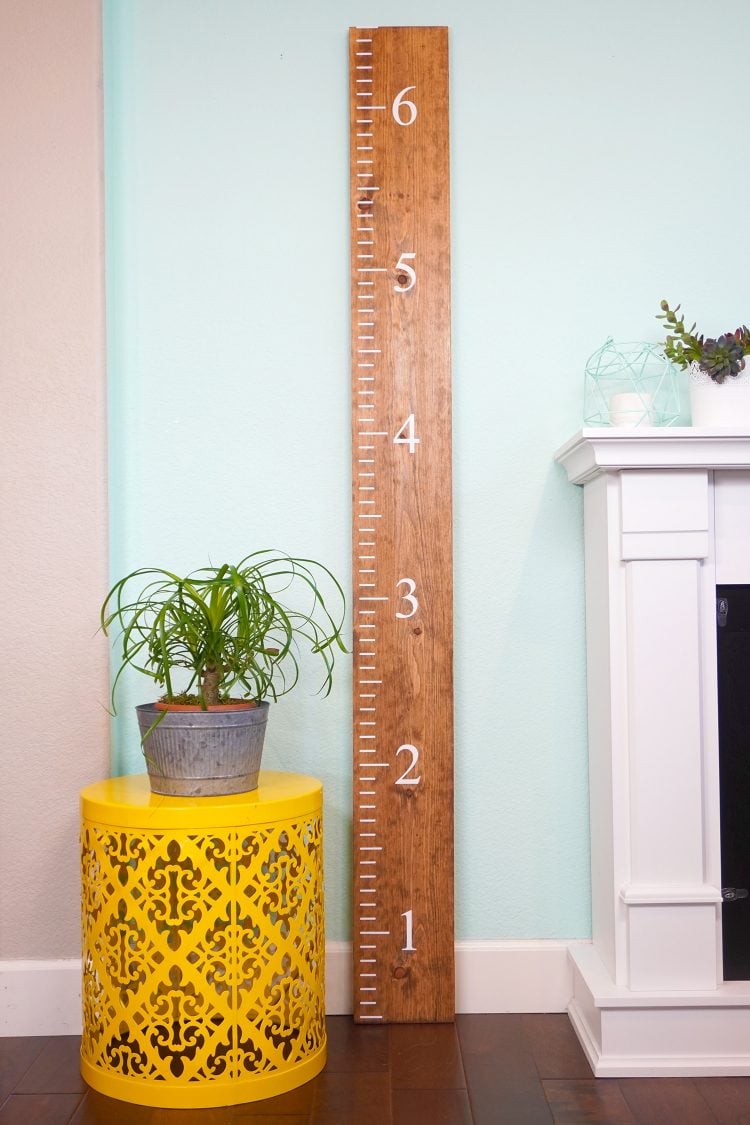DIY wooden ruler growth chart in living room