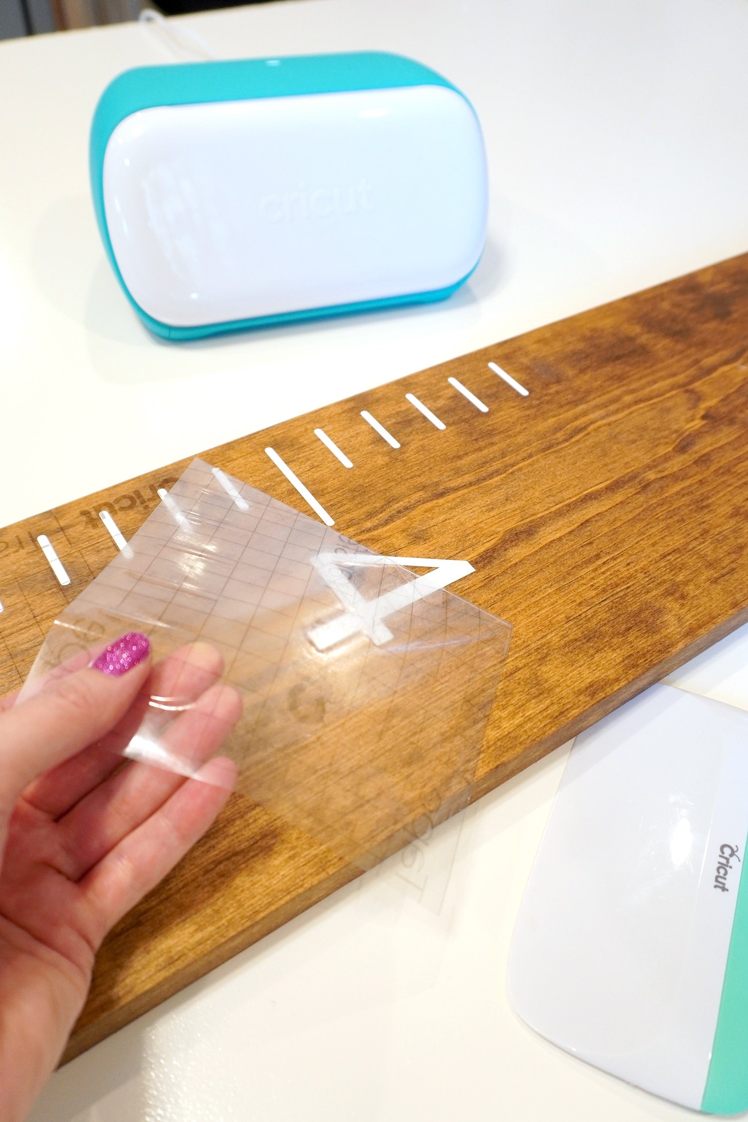 peeling and revealing vinyl on growth chart