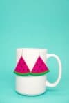  watermelon slice earrings on mug