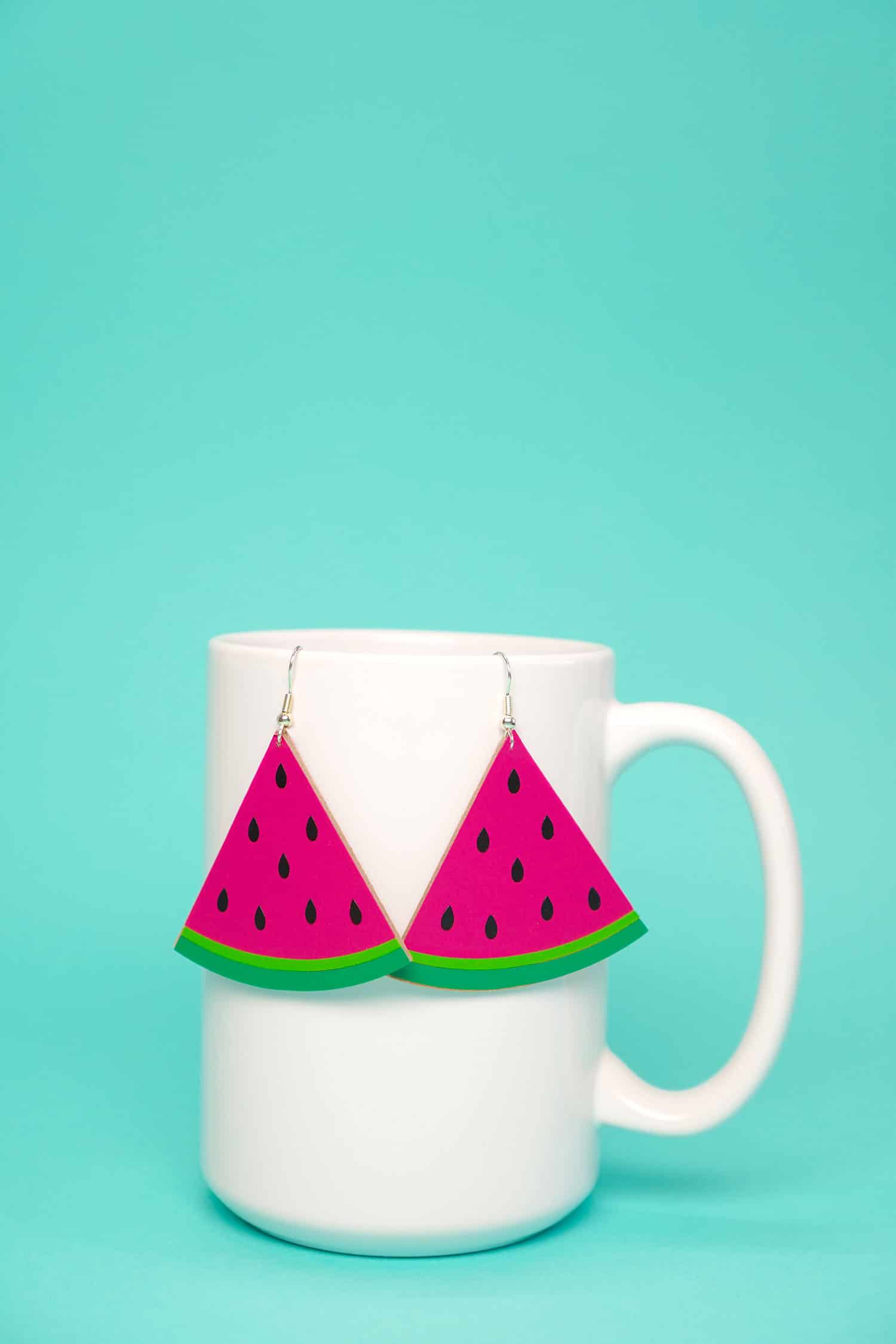 watermelon slice earrings on mug